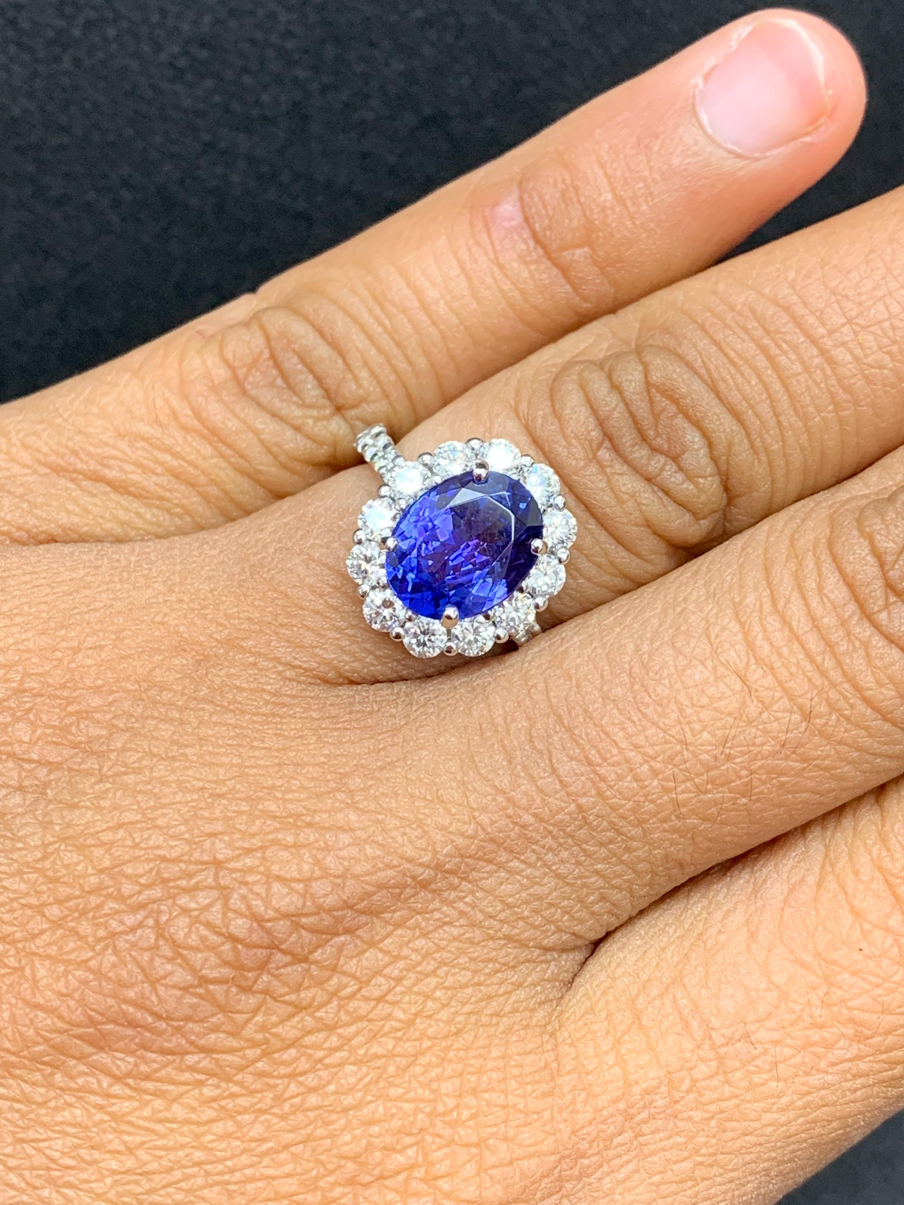 2.45 Carat Oval Cut Tanzanite and Diamond Halo Flower Ring in 18K White Gold For Sale 6
