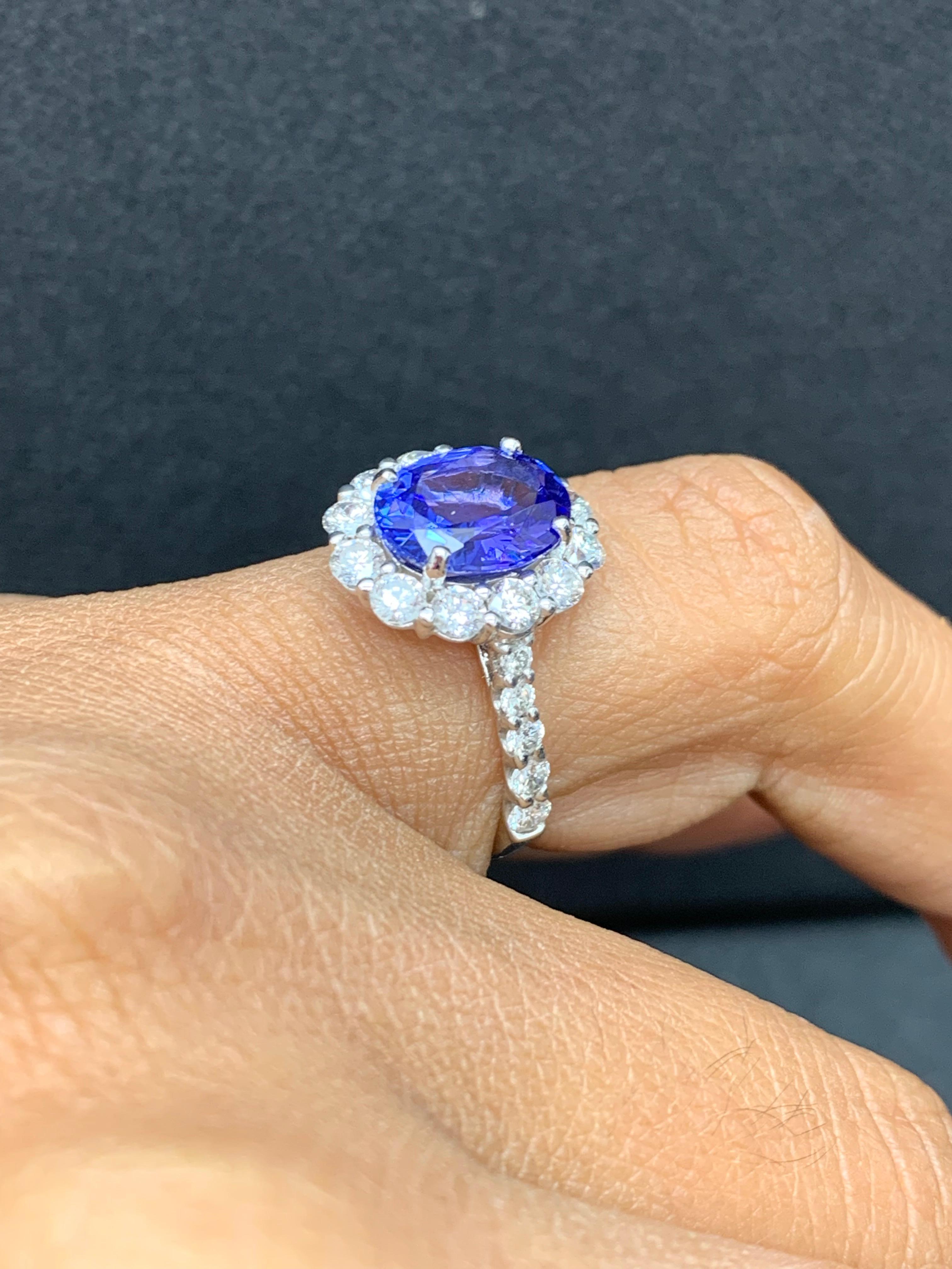 2.45 Carat Oval Cut Tanzanite and Diamond Halo Flower Ring in 18K White Gold For Sale 7