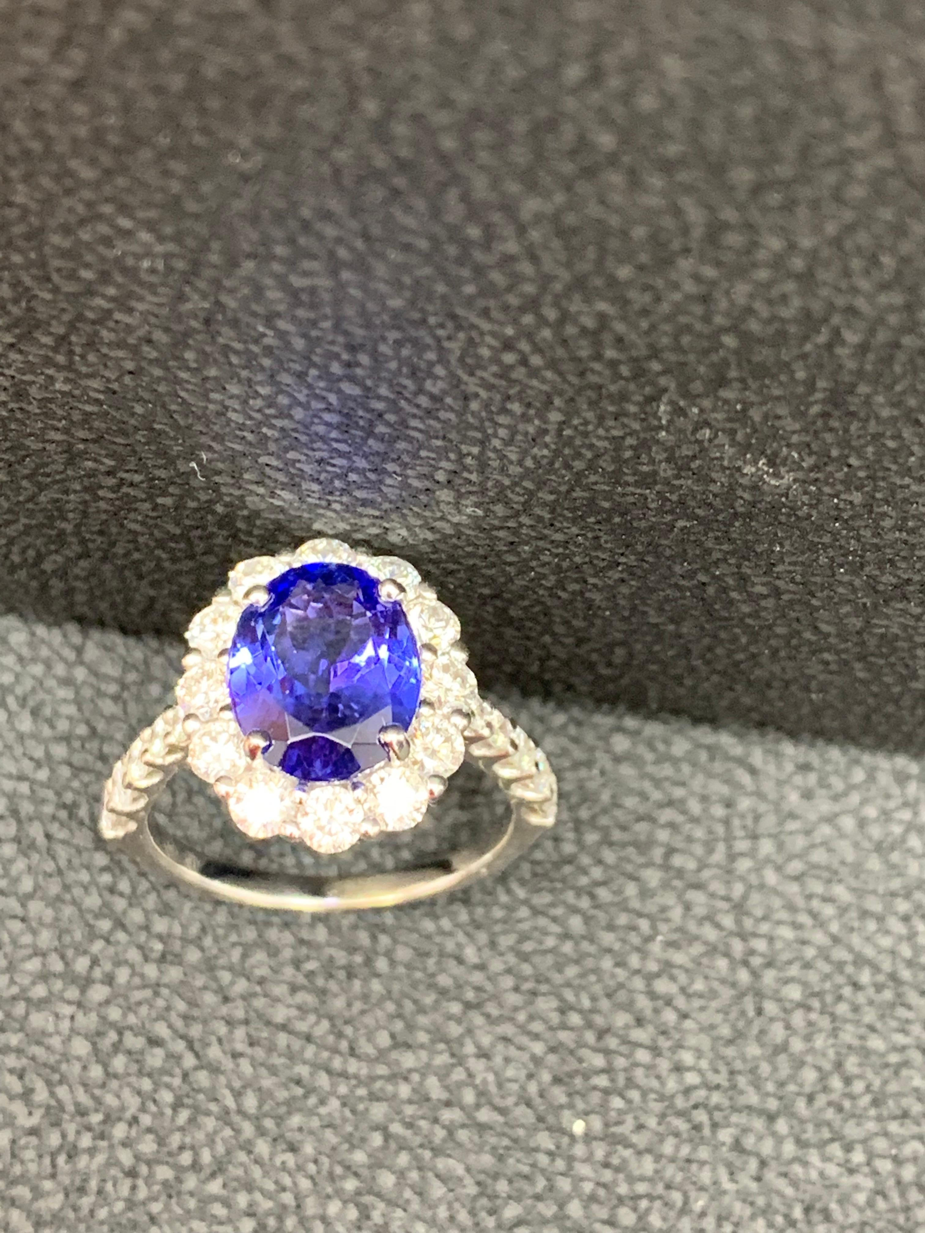 2.45 Carat Oval Cut Tanzanite and Diamond Halo Flower Ring in 18K White Gold For Sale 1