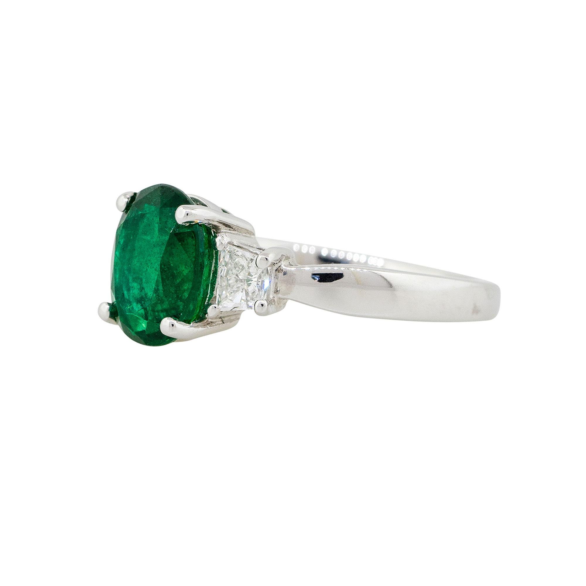 Oval Cut 2.45 Carat Oval Emerald Ring with Trapezoid Diamonds 18 Karat in Stock