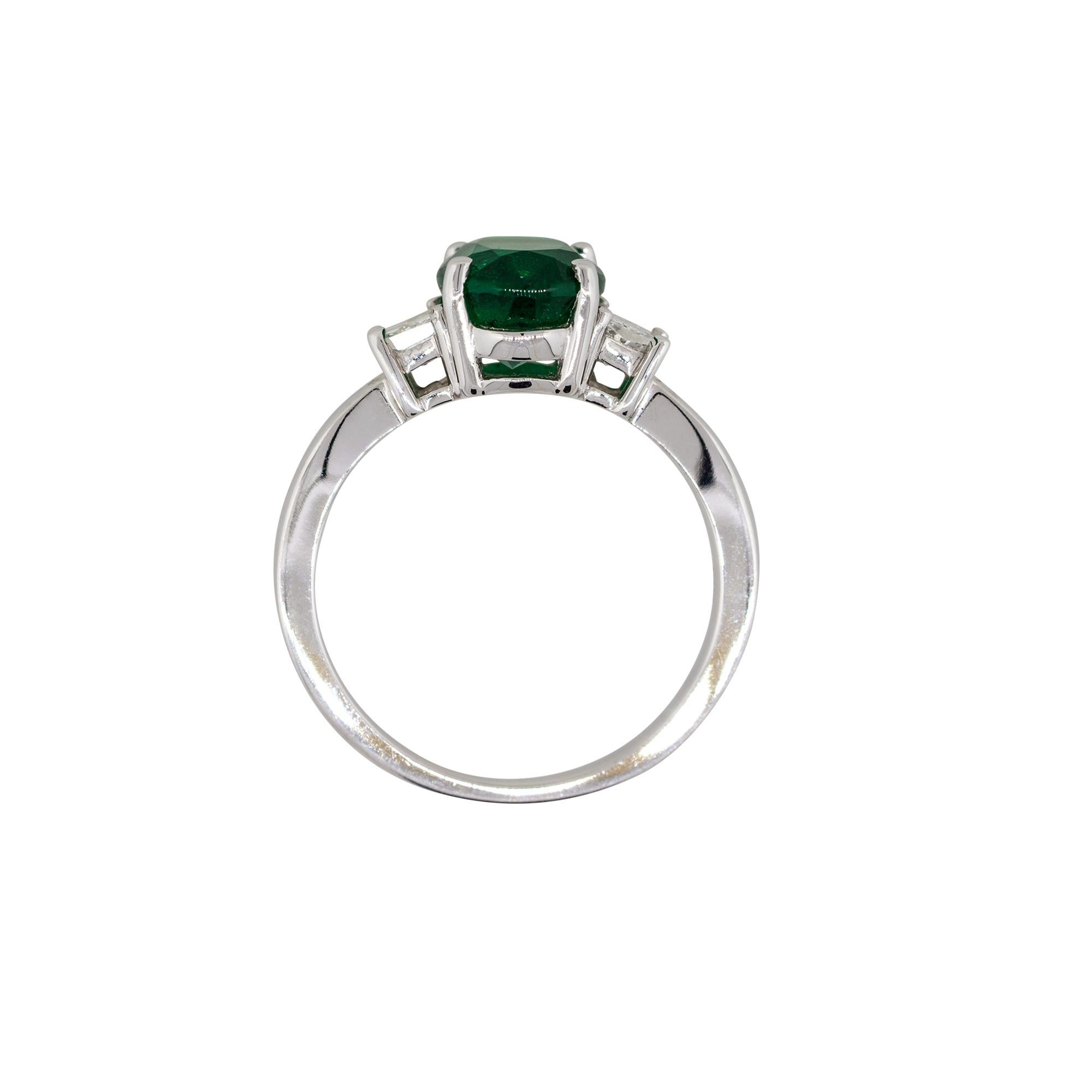Style: Three stone emerald ring with diamonds
Material: 18k White gold
Diamond Details: Approximately 0.34ctw of trapezoid cut diamonds. Diamonds are G/H in color and VS in clarity
Gemstone Details: Approx. 2.45ct oval cut emerald gemstone. Center
