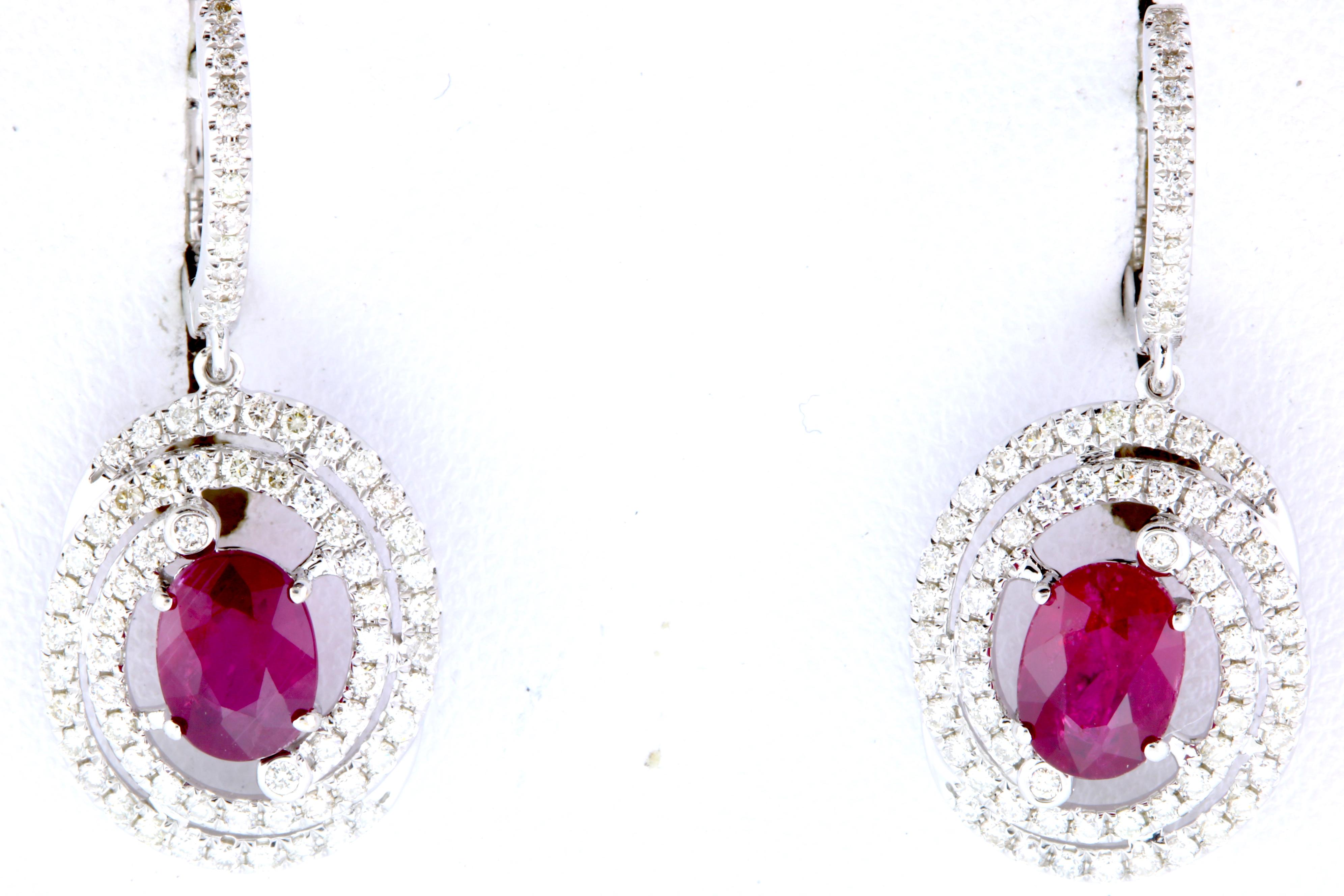 Contemporary 2.45 Carat Oval Ruby and .75 Carat Diamond Earrings