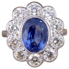 2.45 Carat Sapphire and 1.60 Carat Total Diamond Cluster Ring in Platinum