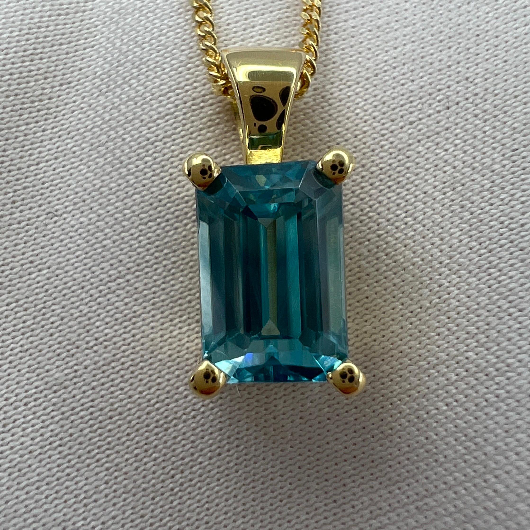 Vivid Neon Blue Natural Zircon Emerald Cut 18k Yellow Gold Pendant Necklace.

Beautiful natural 2.45 carat blue zircon set in a fine 18k yellow gold solitaire pendant. Stunning blue zircon with a vivid neon blue colour and excellent clarity, very