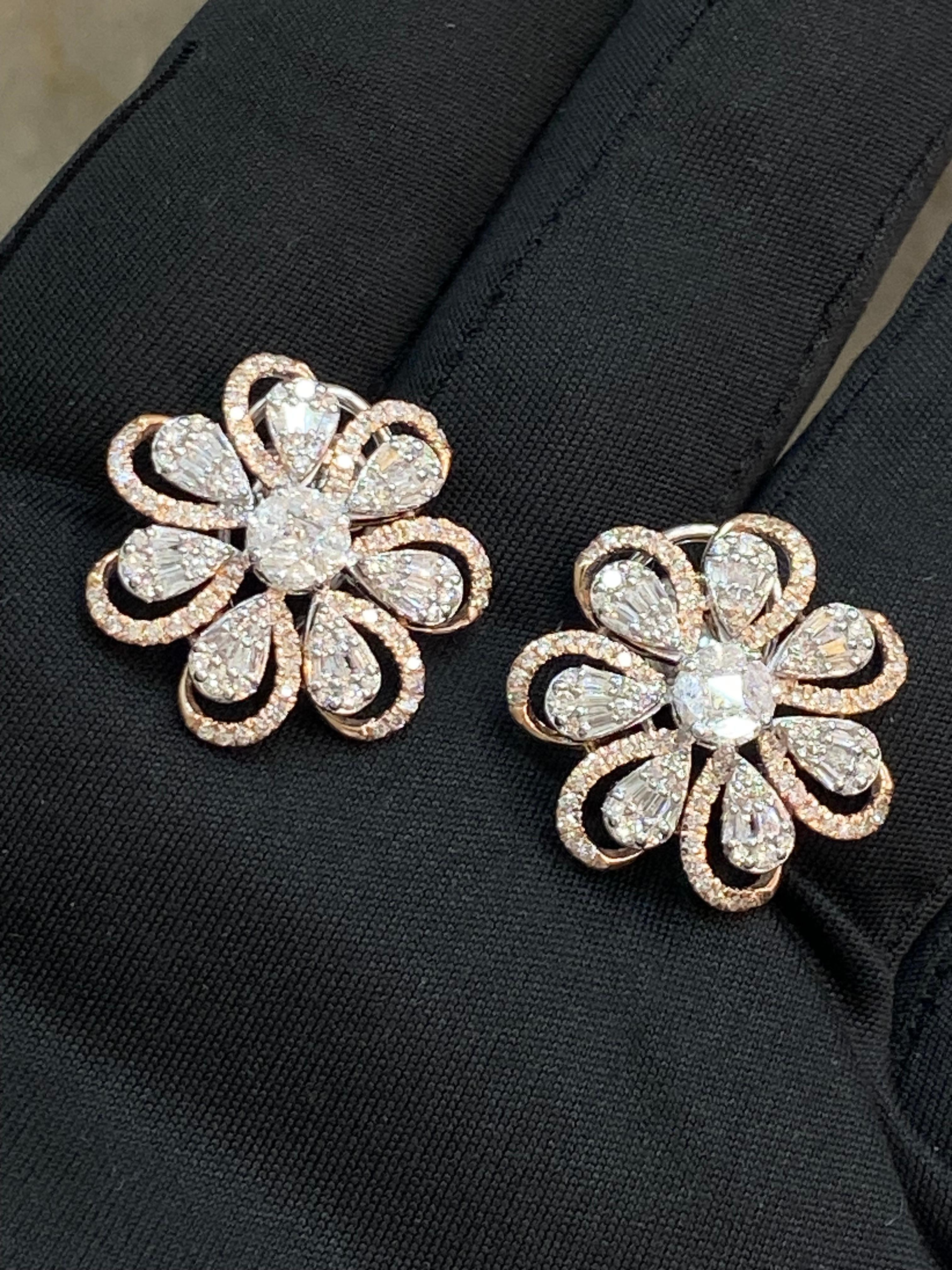 Experience glamour in its purest essence with these earrings. Treat yourself to the mesmerizing allure of these breathtaking 2.45 carat diamond earrings in 14k gold. Designed to bring joy and radiance, they are destined to adorn you with endless