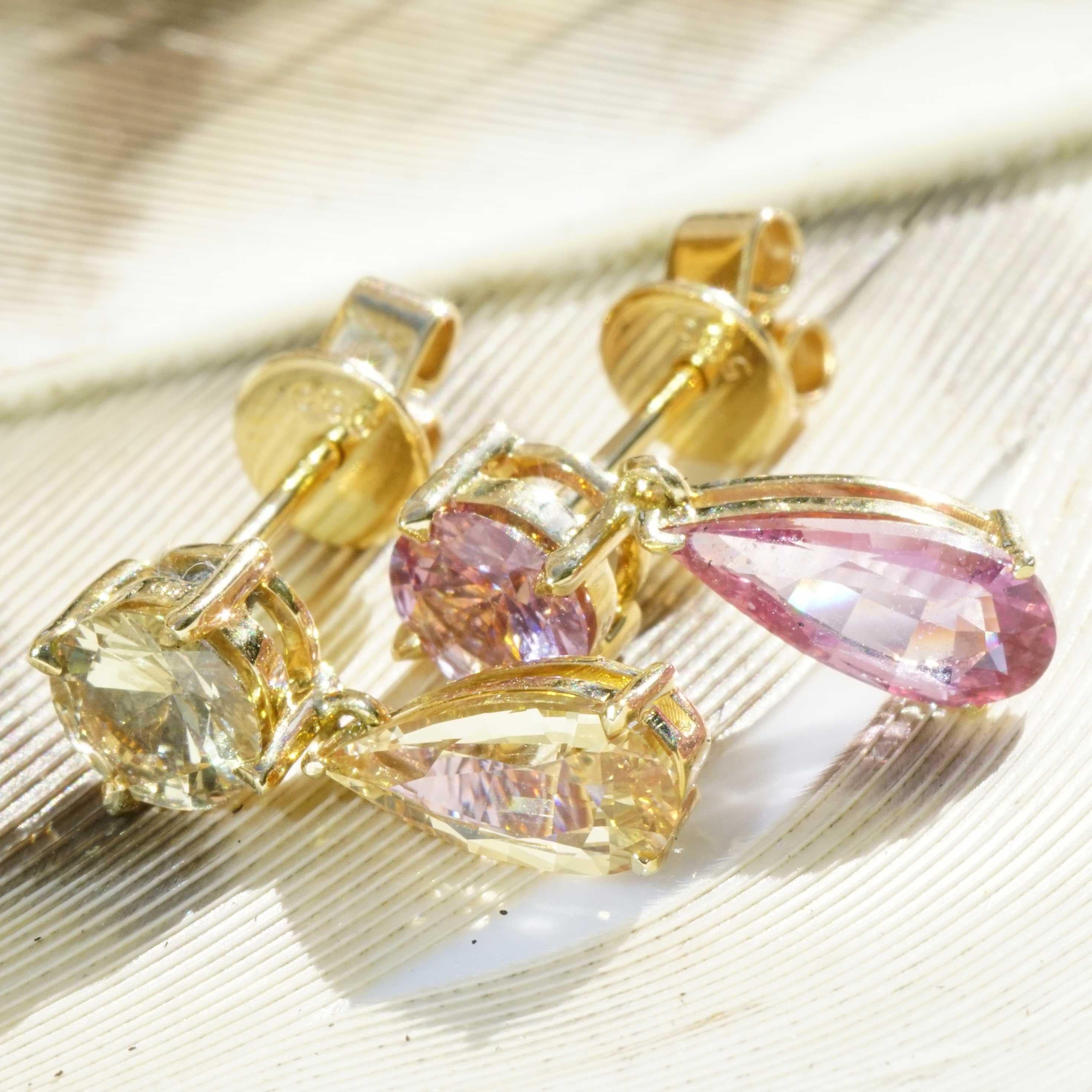 untreated NATURAL COLOR sapphires in overwhelming colors...always a rarity because most sapphires are heated, stud earrings classically set in 750 yellow gold, 4 sapphires,  drops and round, in different colors purple-pink and yellow-greenish total