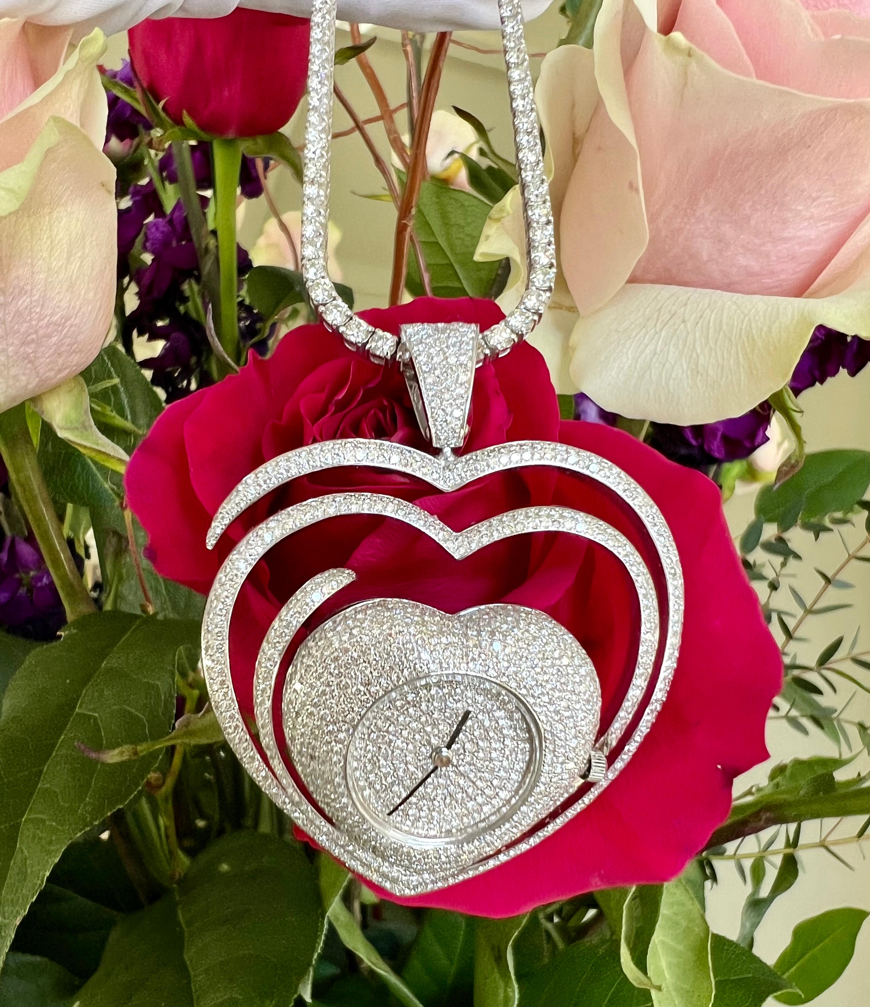 Magnificent and very unique, hand crafted estate heavy 18 karat white gold pave diamond heart shaped watch pendant features a myriad of over 1200 round brilliant white diamonds creating a captivating burst of the most glistening beauty to be worn on