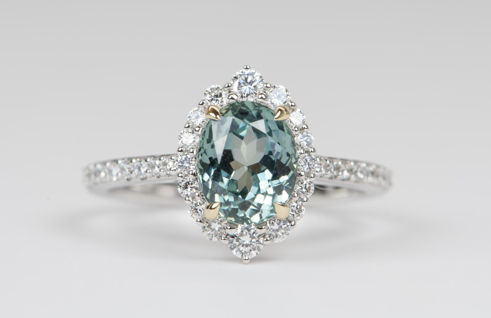 ♥  Solid 14K white gold ring set with a large oval Montana sapphire in the center, flanked by a beautiful halo featuring gradual-sized diamonds
♥  A delicate beaded band accentuates the setting and main sapphire
♥  The center stone is set with