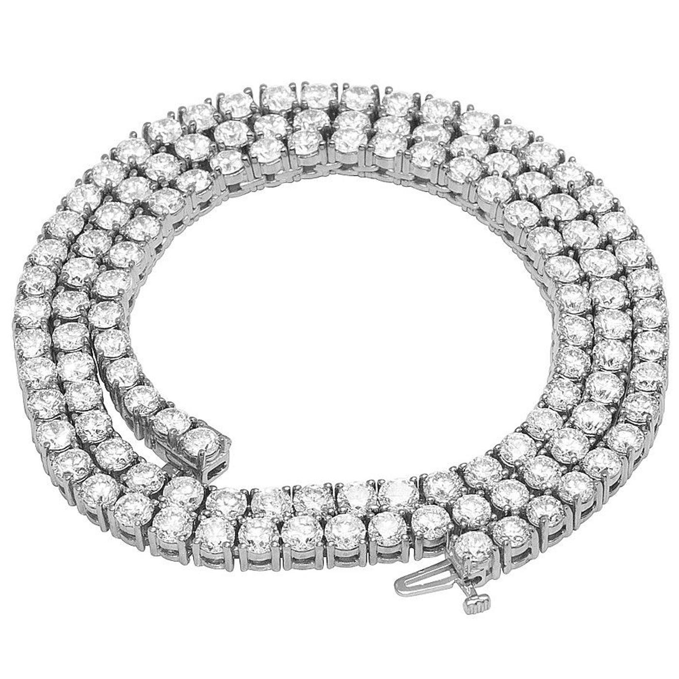 This Diamond Tennis Necklace Features 24.5 Ct of Round Diamonds. Beautiful tennis necklace made of diamonds. an essential piece of jewelry. in 14-karat white gold. The delicate 4-prong in-line chain on this tennis necklace is encrusted with