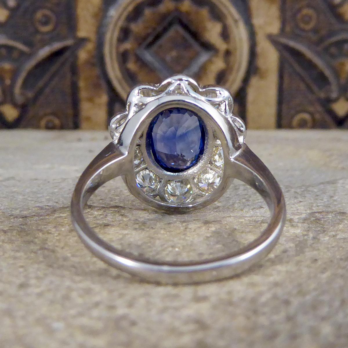 Oval Cut 2.45 Carat Sapphire and 1.60 Carat Total Diamond Cluster Ring in Platinum