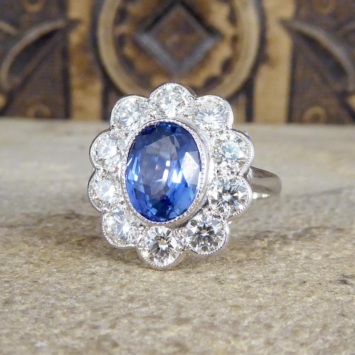 2.45 Carat Sapphire and 1.60 Carat Total Diamond Cluster Ring in Platinum In Good Condition In Yorkshire, West Yorkshire