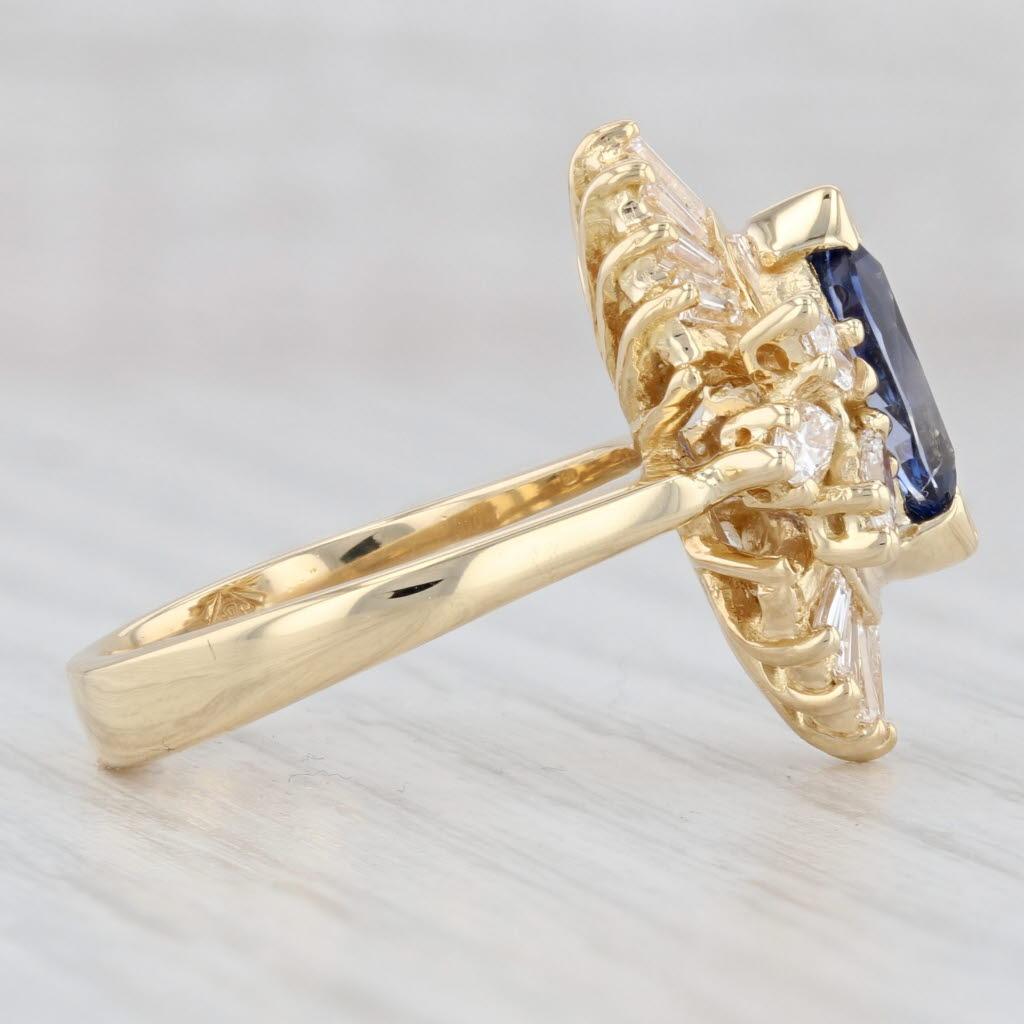 Gemstone Information:
- Natural Sapphire -
Carats - 1.20ctw
Cut - Marquise
Color - Dark Blue
Treatment - Heated

- Natural Diamonds -
Total Carats - 1.25ctw
Cut - Marquise 0.60ctw, Baguette 0.65ctw
Color - F - G
Cut - VS2 - SI1
*Please note one of