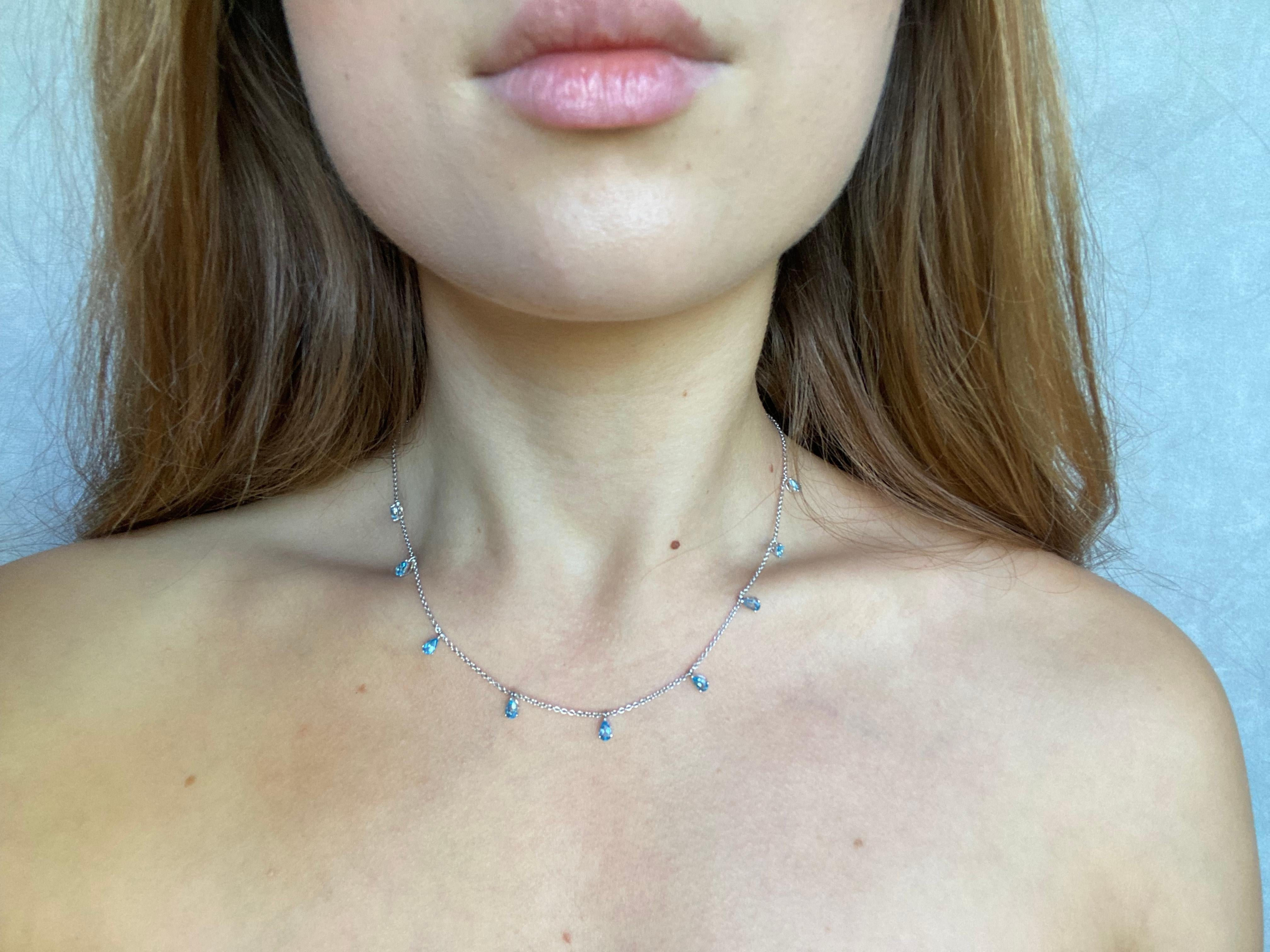 The ultra light adjustable construction of this Chocker necklace allows you to control the length of the chain and wear it either as a high neck Chocker or a relaxed casual necklace on your collarbones. These timeless pear shaped Swiss blue topaz