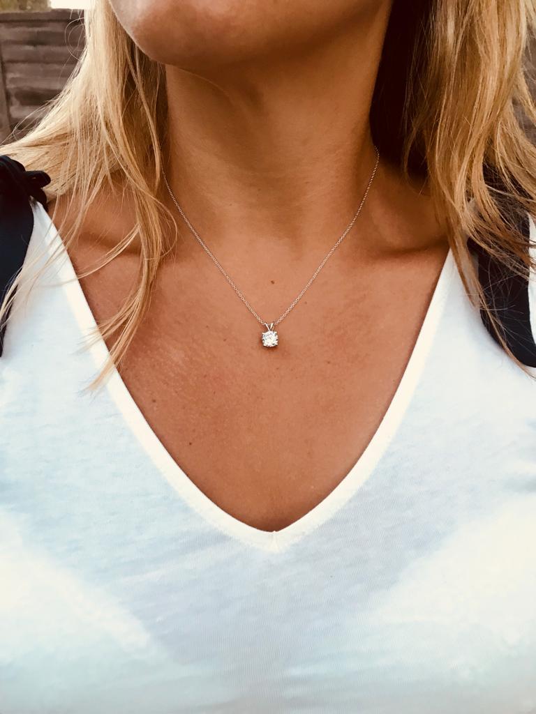 A beautiful solitaire pendant that is sure to draw admiring glances.

Featuring a 2.46ct round brilliant cut, set in a classic four prong setting.

Composed of 925 sterling silver with a white rhodium finish.

Chain measures 16 inches with a two