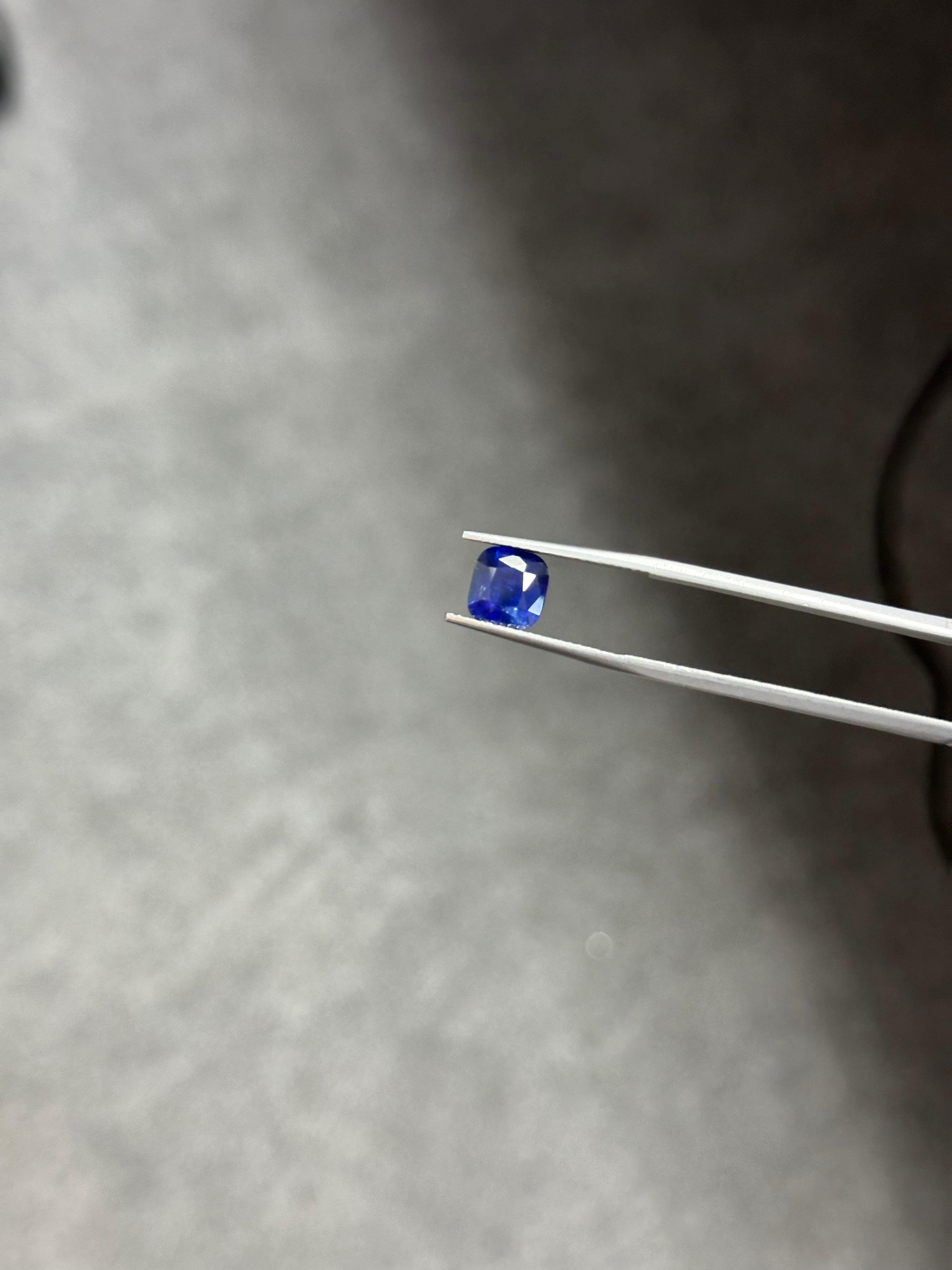 A 2.46 Carat Sapphire, resplendent in a royal blue hue. It hails from the enchanting gem mines of Sri Lanka. This exquisite gem has undergone standard heat treatment only, maintaining its 100% natural origin. The sapphire is cut to perfection in an