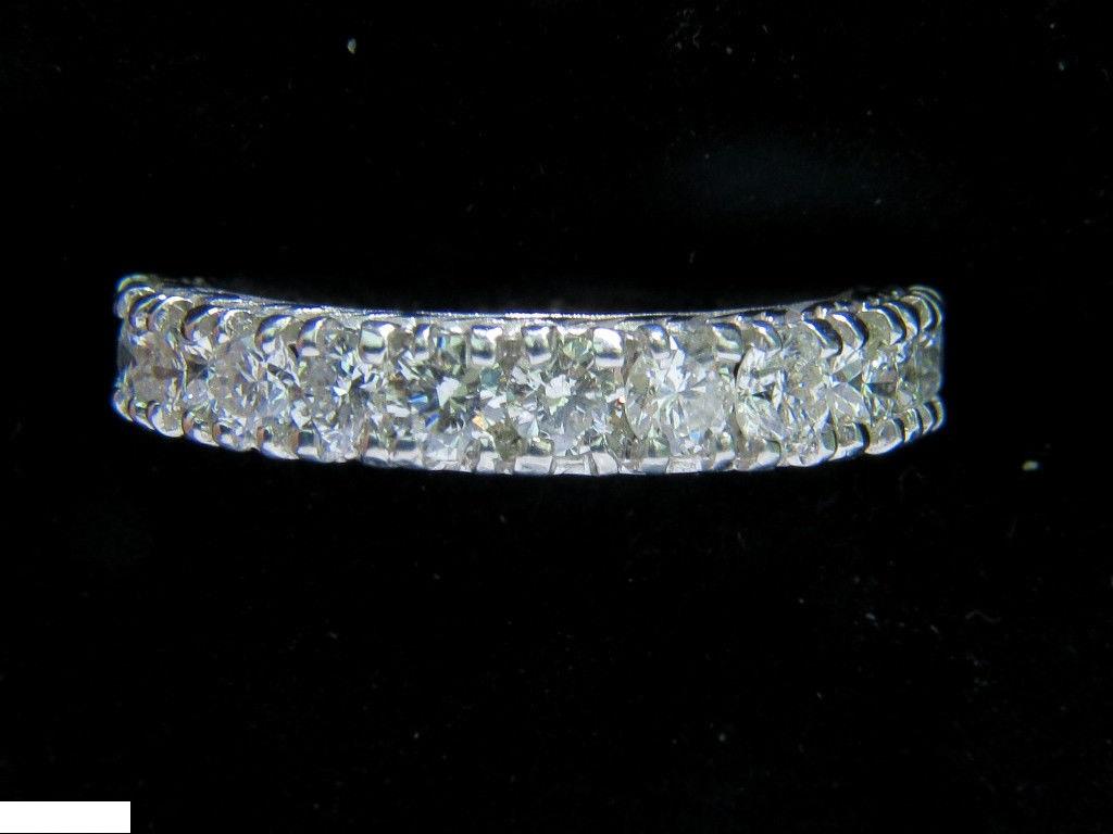 2.46ct. Eternity round diamonds ring

Kissing diamond effect

mostly sparkles, less metal

H-color, vs-2 clarity

Absolutely Brilliant

Gorgeous Weave pattern on profile

14kt. white gold

4.3 grams

current size: 6 1/4

(we can not resize).

3.9 mm