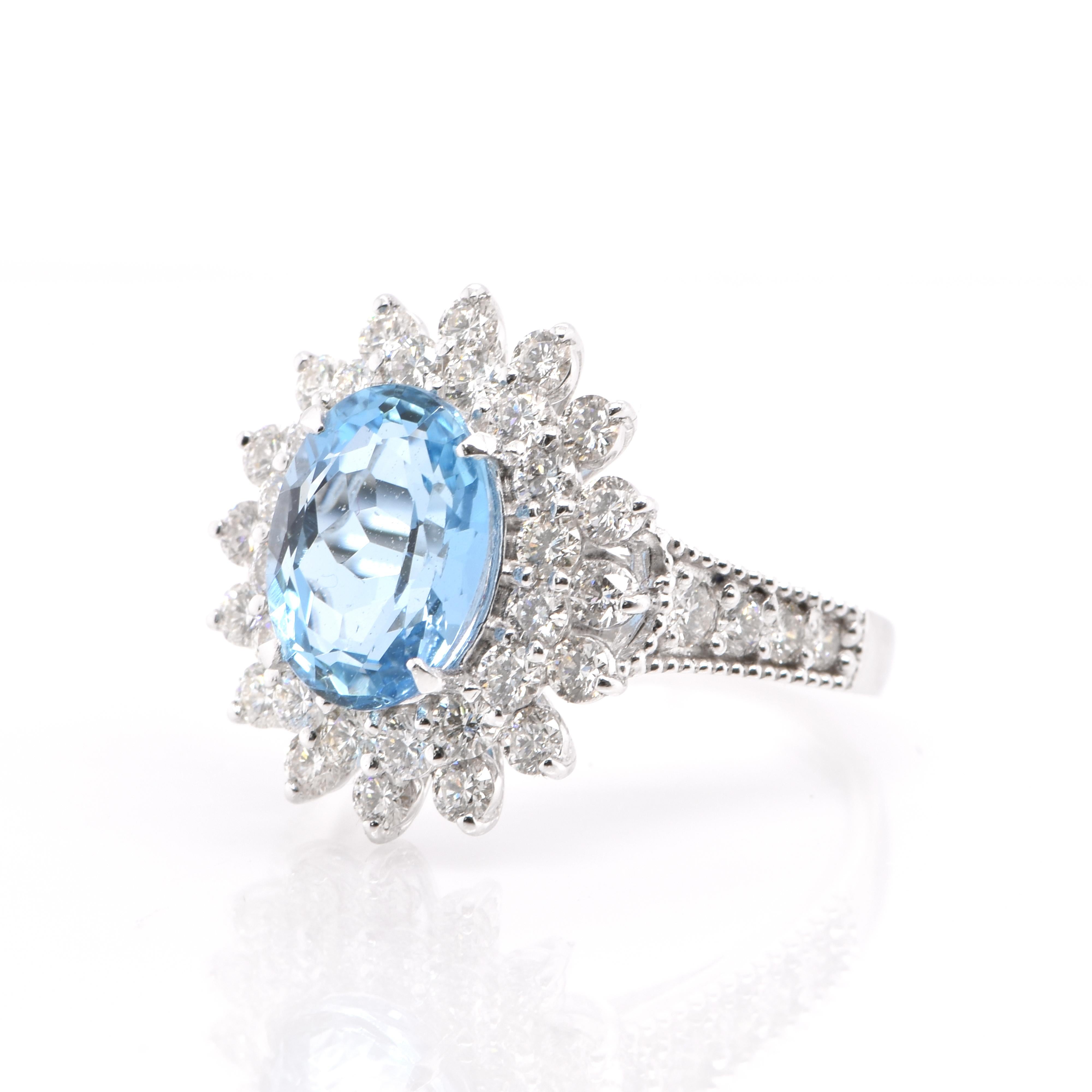 A classy 2.46 Carat, Natural Oval-Shaped, Santa-Maria Colored Aquamarine Cocktail Ring with 1.31 Carats of Diamond Accents set in Platinum. Aquamarines have been prized gems throughout human history for their cool blue color. They historically come