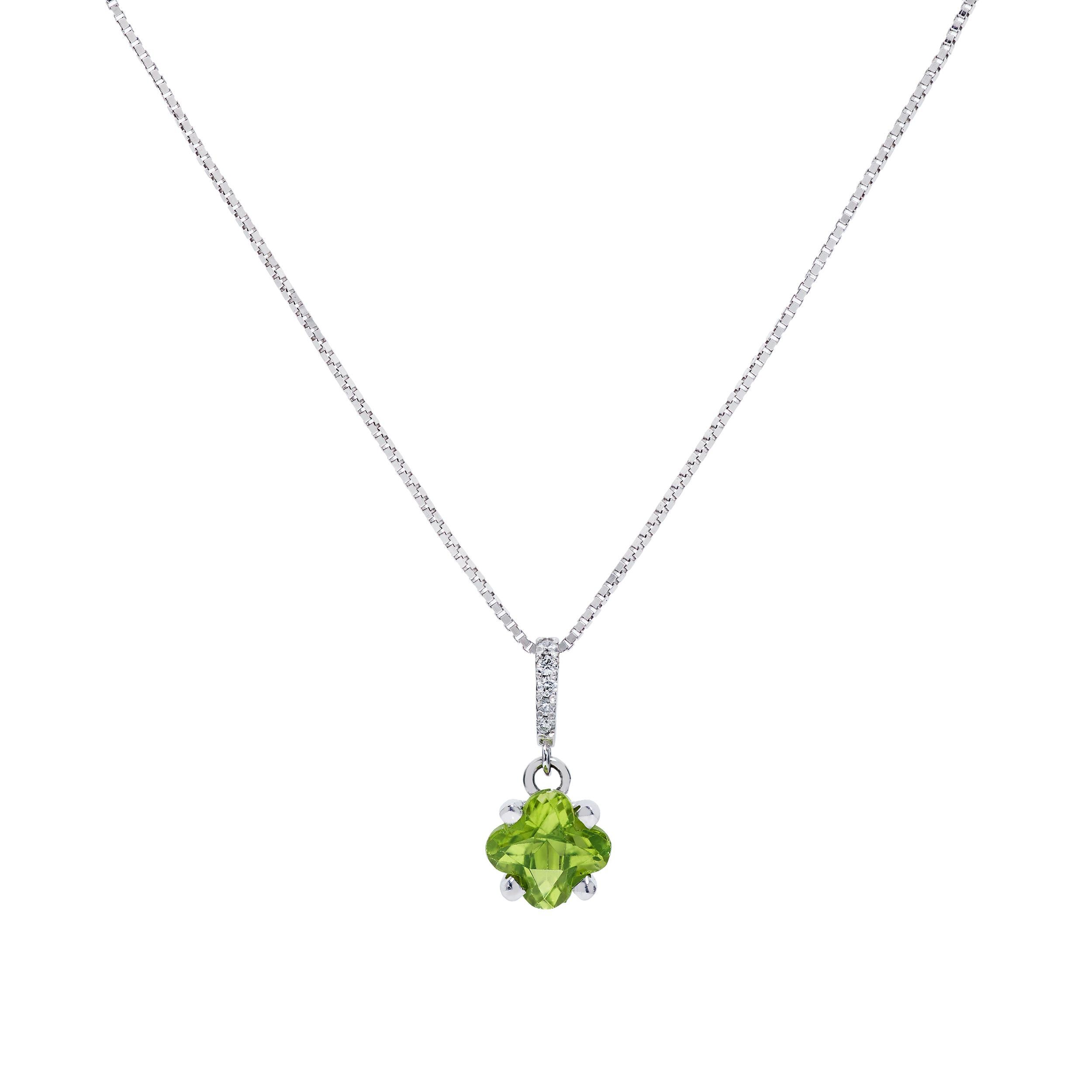 2.46 carats flower shaped Peridot & Diamond necklace set in 18 karat white gold

Pendant Features
     Clover-shaped Peridot weighing 0.88 Cts
     
Earrings Feature
     2 Clover-shaped Peridot weighing 1.58 Cts 