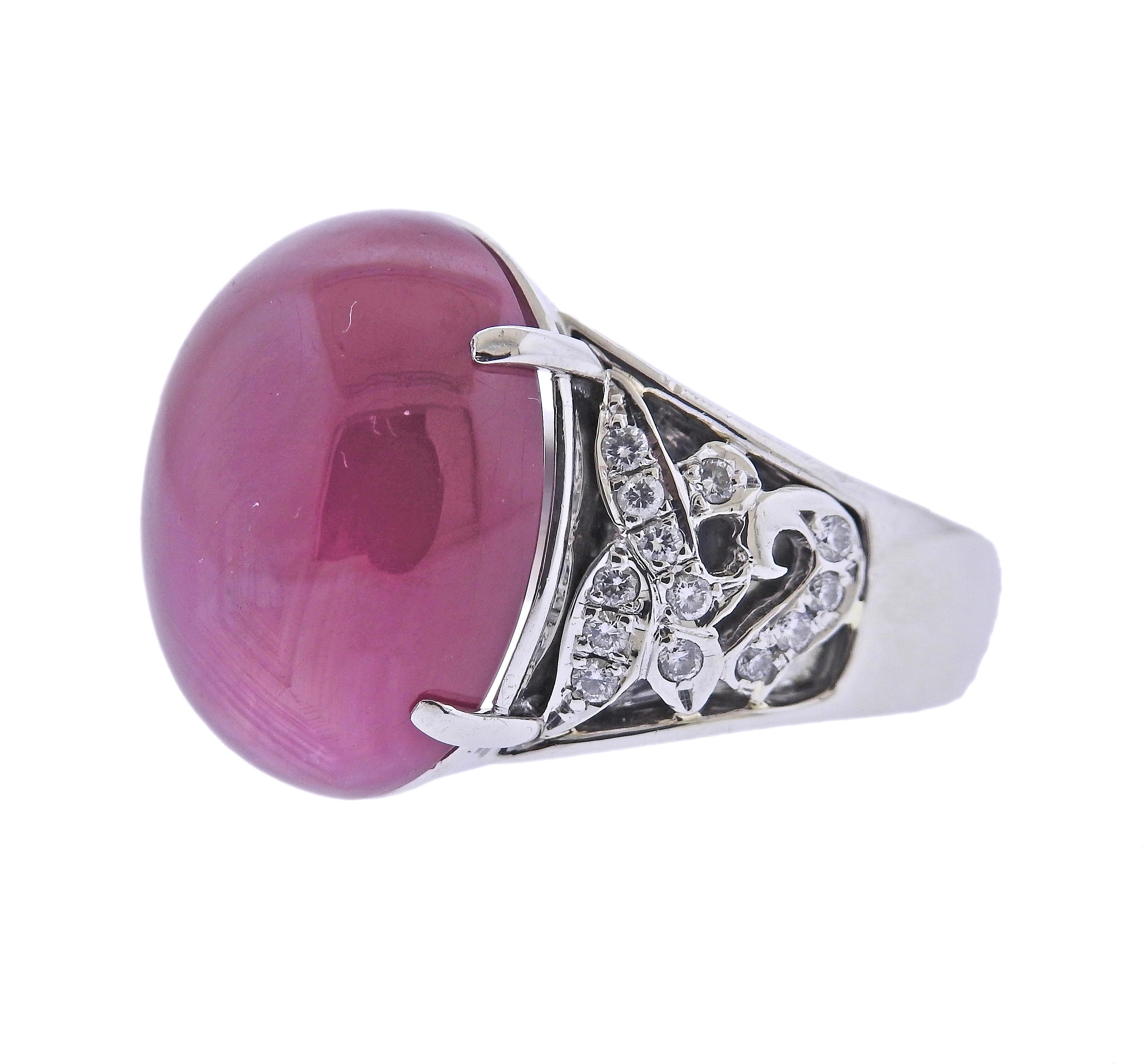 Impressive platinum ring, set with center 24.61ct Burma ruby cabochon (stone measures approx. 17.7 x 14.9 x 7.9mm), surrounded with 0.26ctw in diamonds. Ring size - 5.5. Marked: Pt900, 24.61, D026. Weight - 16.5 grams. 