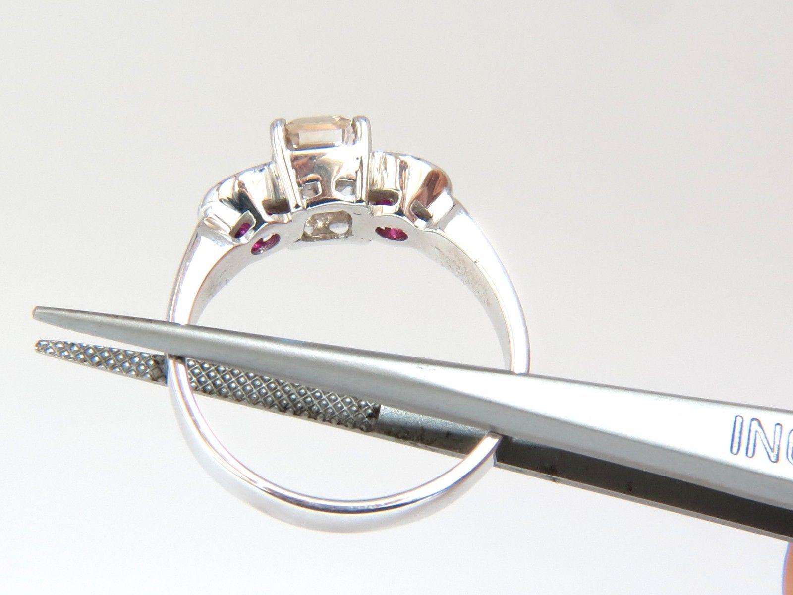 1.30ct. Asscher cut / Natural Fancy light brown diamond ring.

(VS) Clean Clarity 

6.2 X 5.3mm



1.16ct side natural round rubies

Vs- Clean clarity / vivid red.



18kt. white gold.

4.3 grams.

Ring is 6.7mm wide

Depth: 6.5mm

current ring