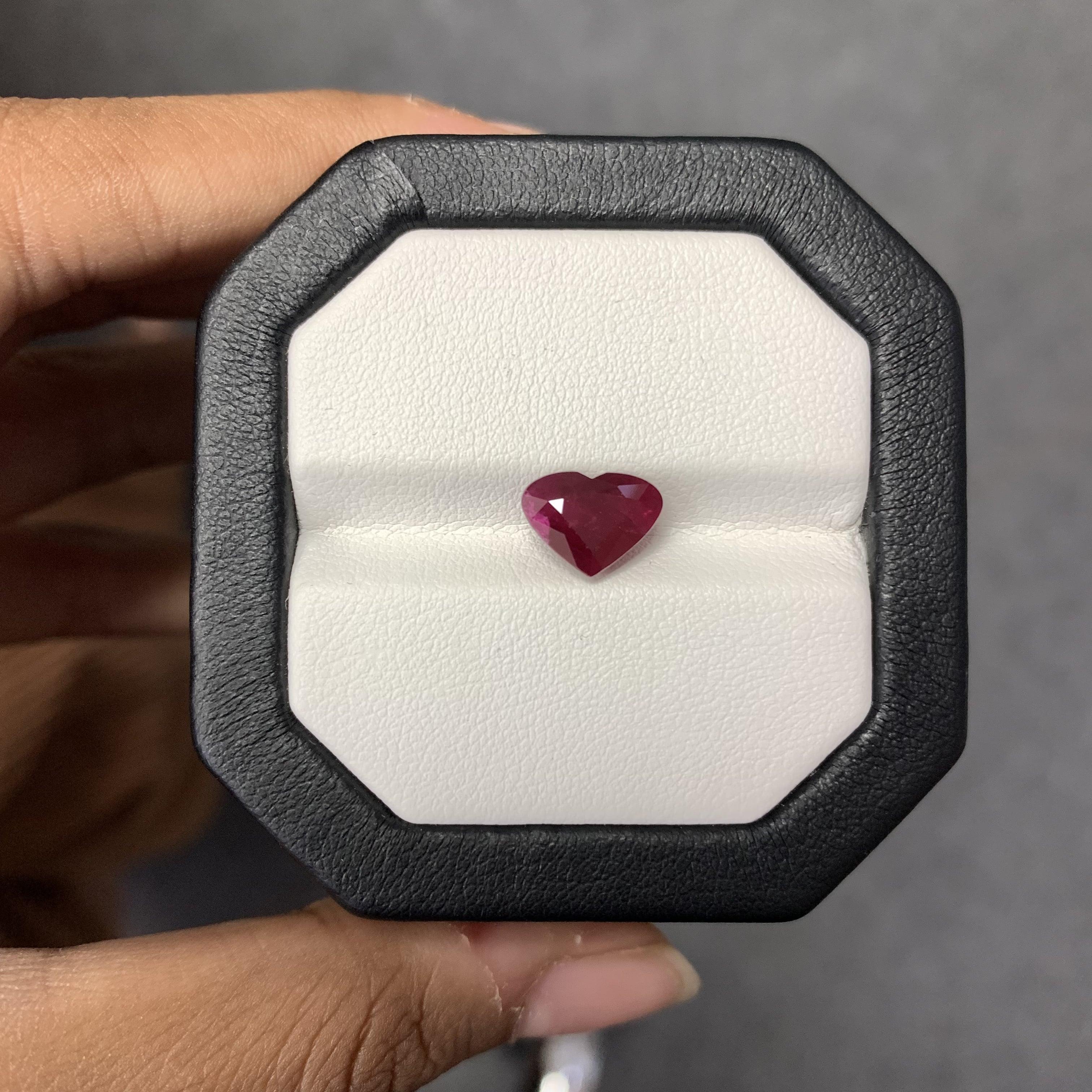 A stunning 2.47 Carat Ruby gemstone. It is completely natural and of good quality. The ruby is a heart shape and its color is a deep, pigeon blood red hue that is absolutely gorgeous!

The measurements of the Ruby stone are 9.87 x 7.42 x