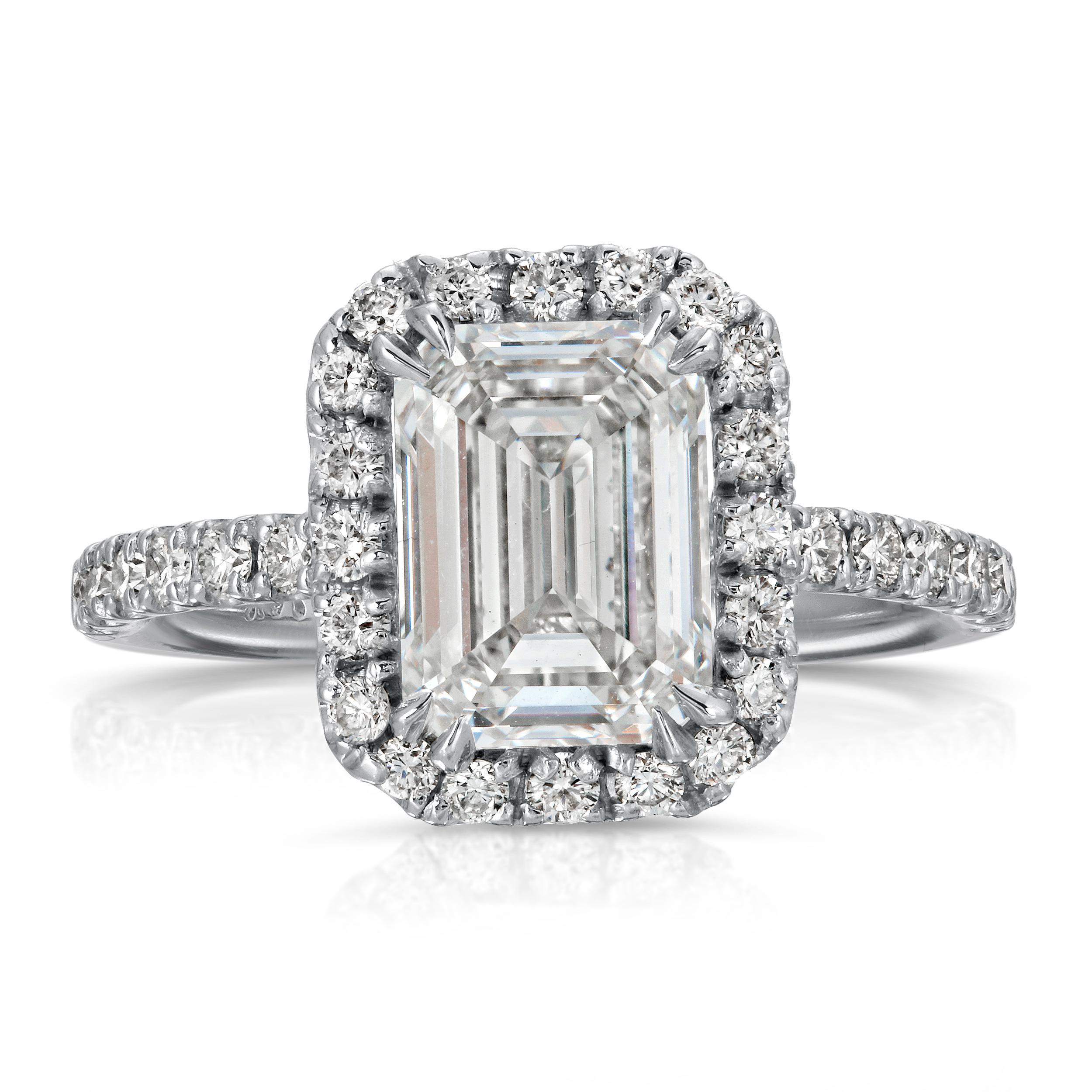 Inspired by Classic Art Deco style and executed this diamond engagement ring will take your breath away. The center diamond is mounted in handmade design of halo diamonds and embraced by pave set diamonds on the undersides of the ring.
Jewel
