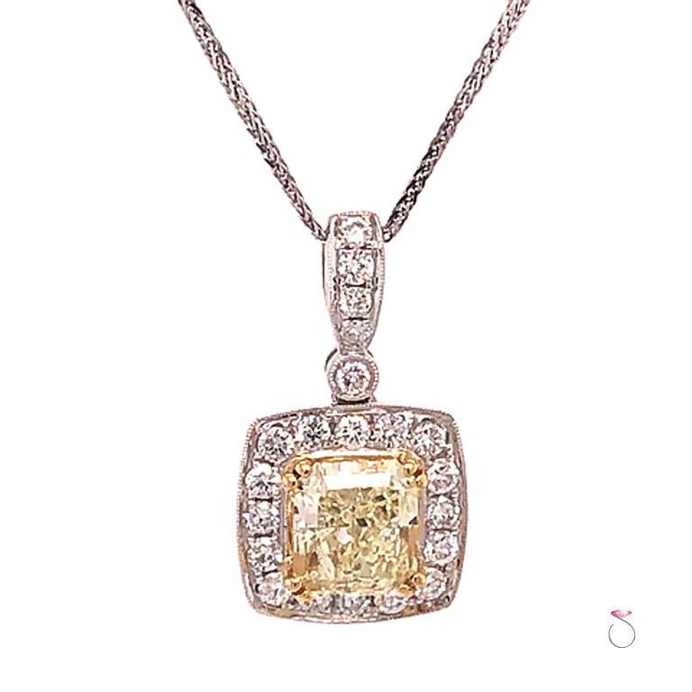 This beautiful diamond pendant features a GIA graded 2.47ct fancy light yellow radiant cut center diamond set in 18k white gold. is just stunning. The stunning center diamond measures 8.07 x 7.09 x 4.73 mm, and is accompanied by a GIA diamond