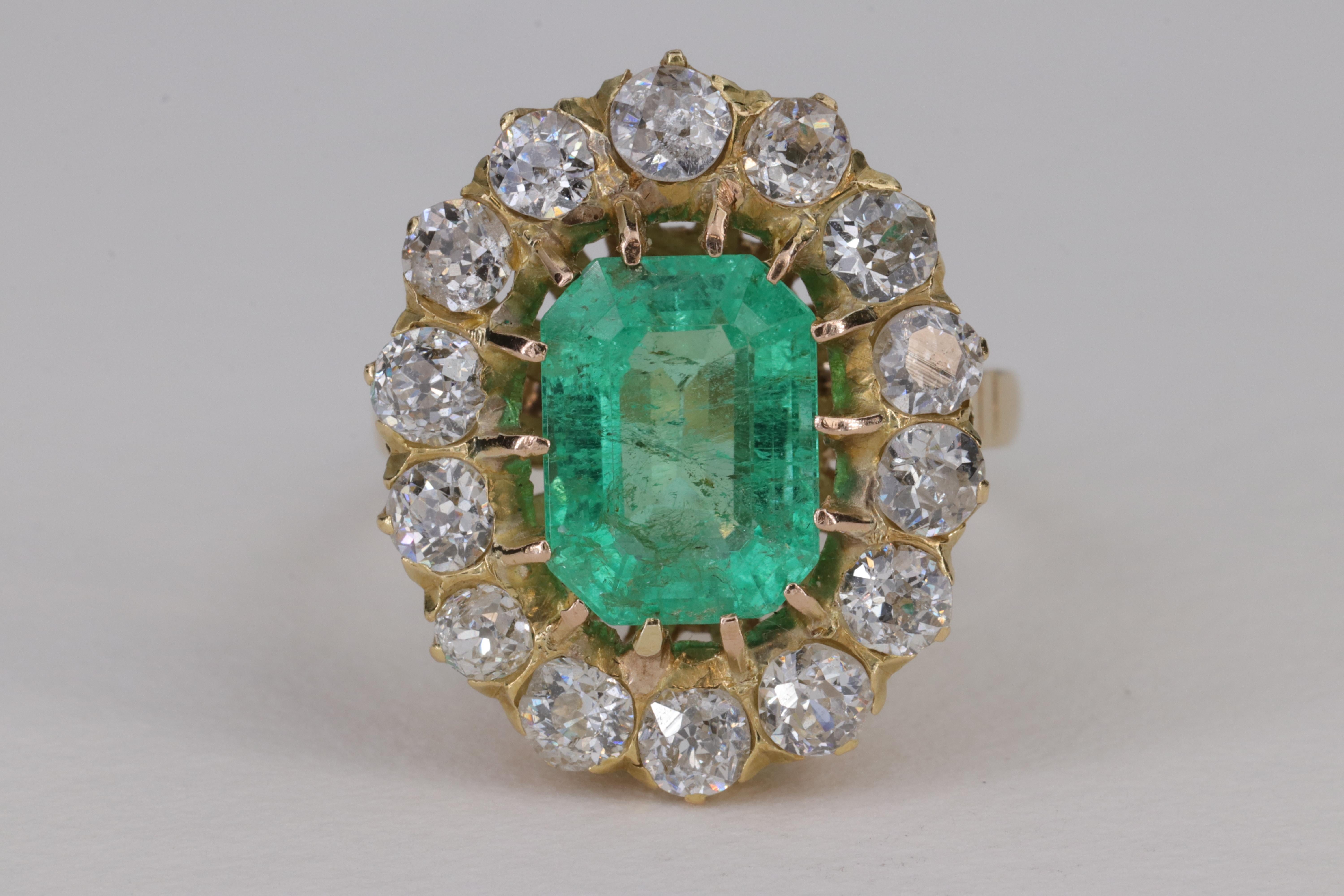 2.47ct Emerald and Old European Cut Diamond Halo Antique Ring

Featuring a lovely emerald cut green emerald center stone weighing approximately 2.47 carats, surrounded by a large halo of old European cut diamonds weighing approximately 1.96 carats