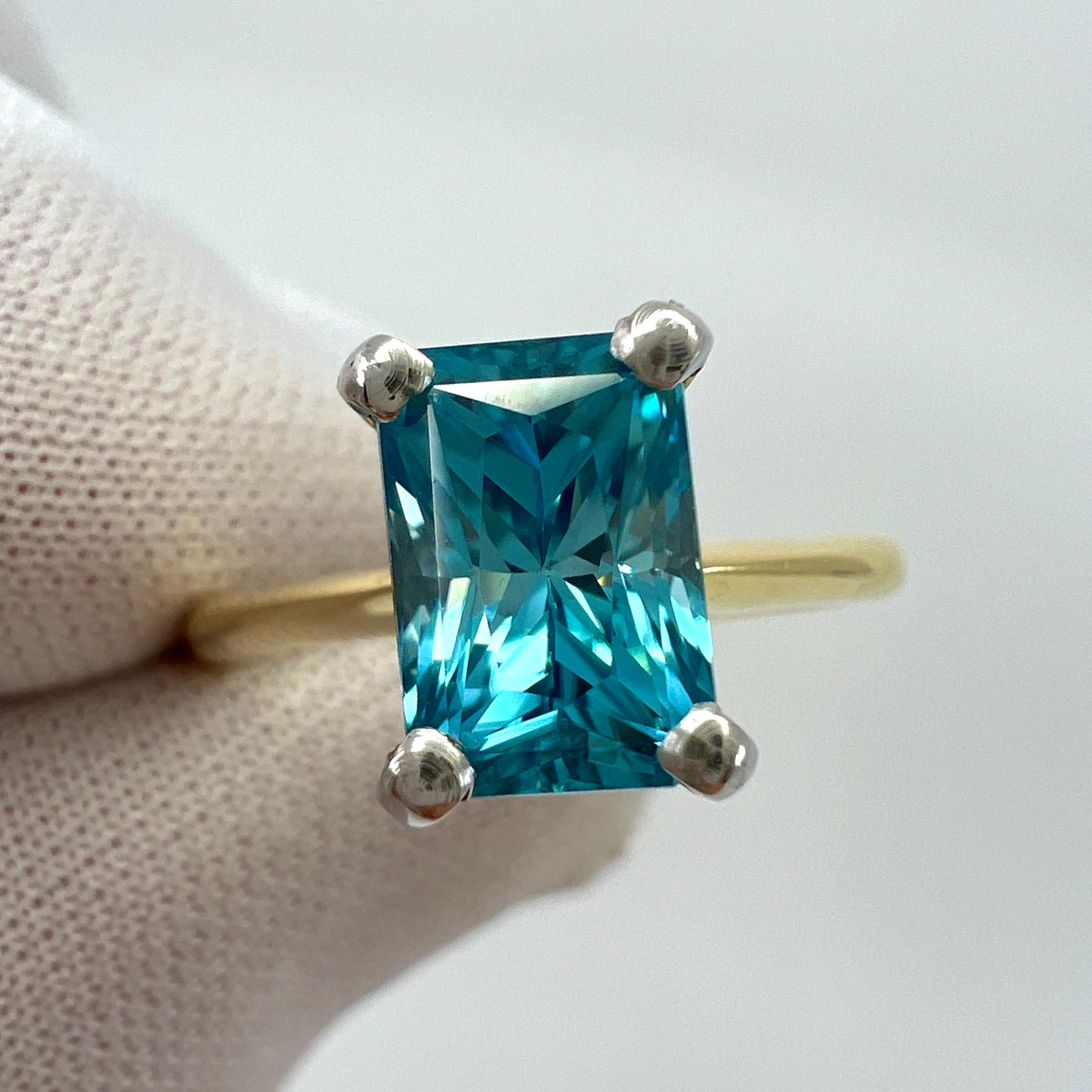 Natural Vivid Blue Zircon Fancy Cut 18k Multi Tone Gold Solitaire Ring.

2.47 Carat natural zircon with a unique fancy emerald radiant cut and stunning vivid blue colour. Measures 8x5.5mm with excellent VVS clarity. Very clean stone.

Set in a