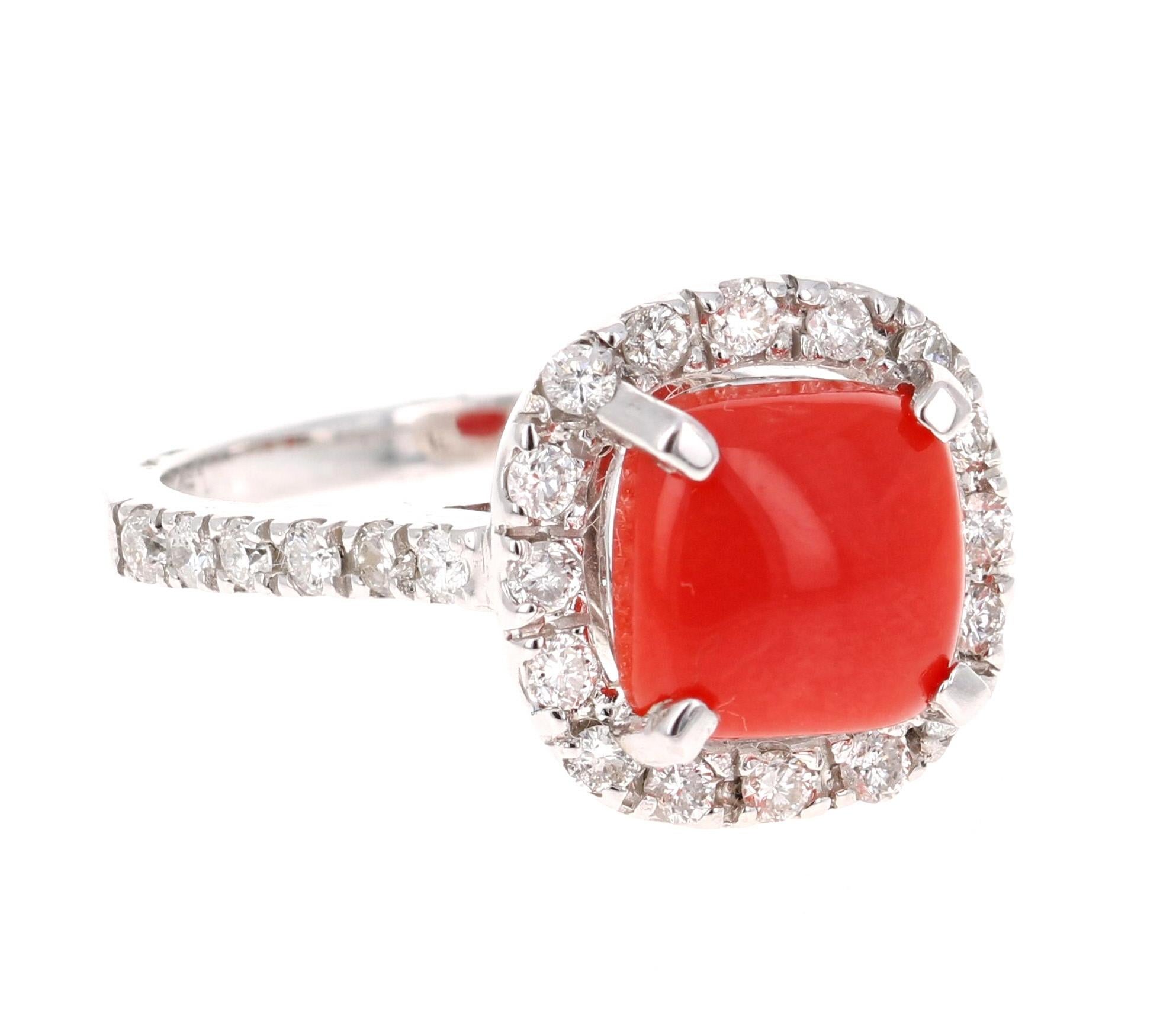 This ring has has 1.91 Carat Coral that is set in the center of the ring.  And it is surrounded by 28 Round Cut Diamonds that weigh 0.57 carats.  The Clarity and Color of the diamonds is SI2 and F.  The total carat weight of the ring is 2.48