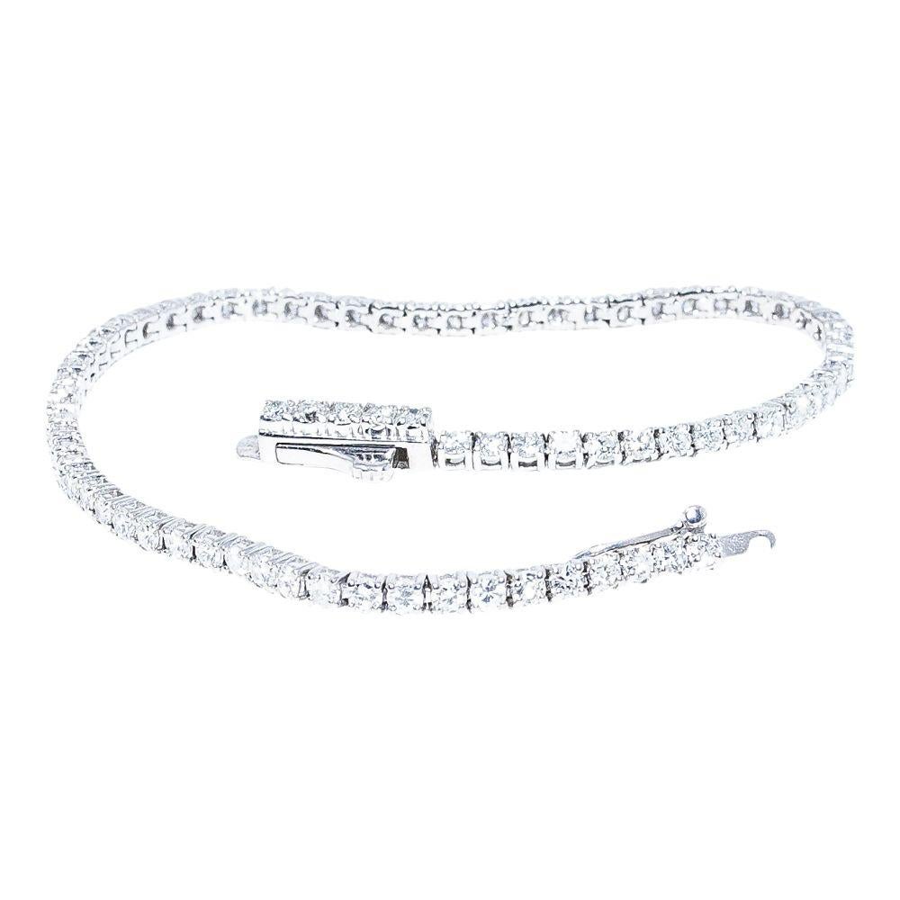 14k white gold bracelet containing 2.48 carats of prong set diamonds. The color and clarity grades of the diamonds contained within the bracelet are E-F, VS1-SI1, respectively. The average polish, symmetry, and cut grade for each of these diamonds