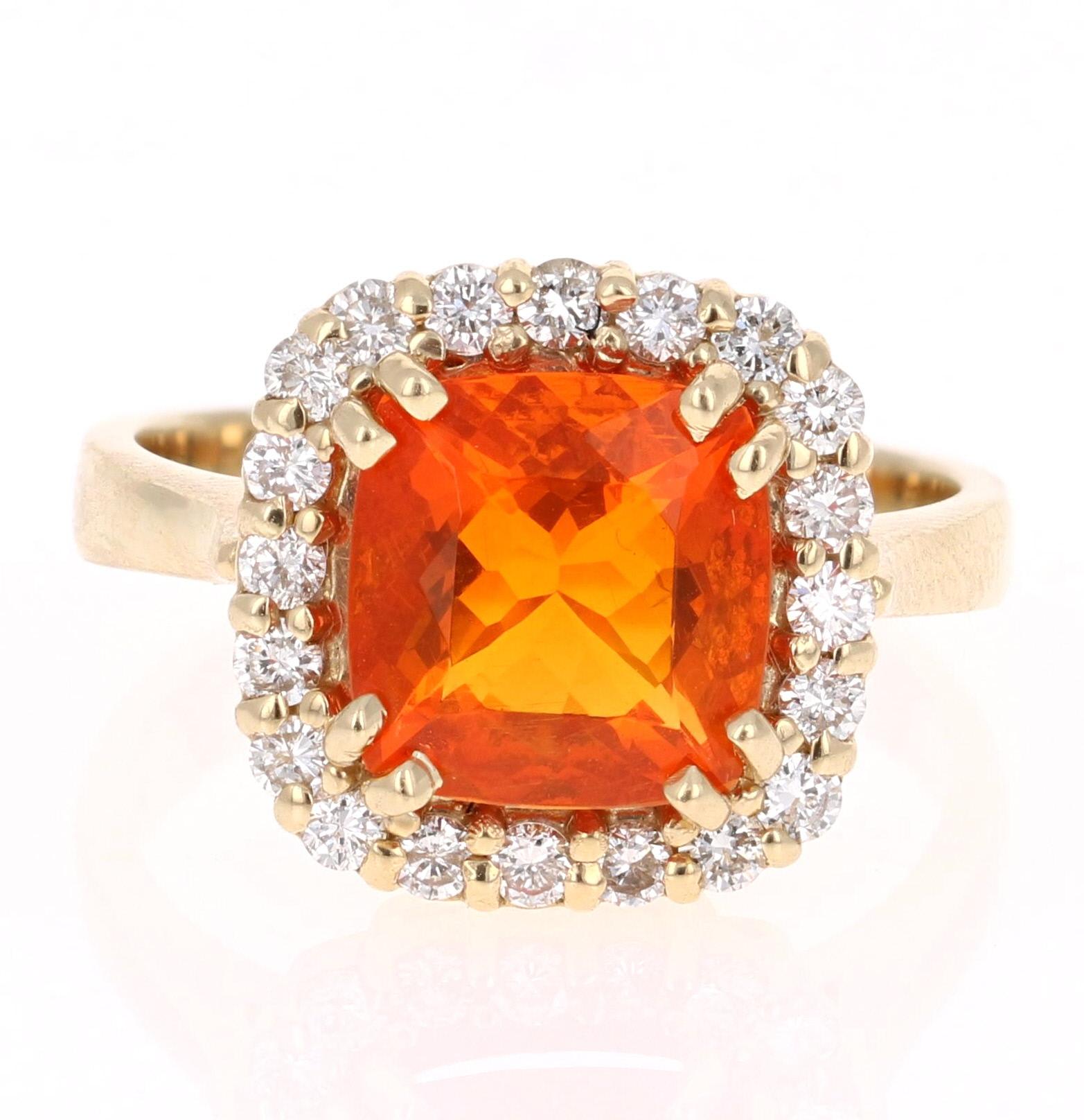 A beautiful Fire Opal and Diamond Ring that is sure to be a blazing beauty on your hand!

This ring has a 1.98 Carat Fire Opal that has a blazing orange hue. It is surrounded by a halo of 20 Round Brilliant Cut Diamonds that weighs 0.50 Carats. The