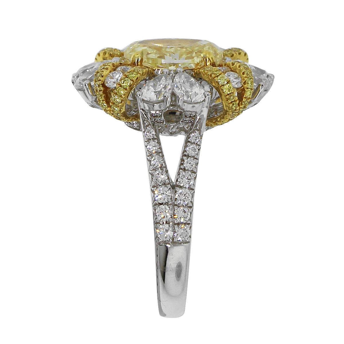 Material: 18k White Gold 
Diamond Details: Approximately 2.37ctw accent diamonds. Diamonds are G/H in color and VS in clarity.
Gemstone Details: Oval shape fancy yellow diamond. Approximately 2.48ct. GIA: 3205401396
Ring Size: 6.5
Total Weight: 9.9g