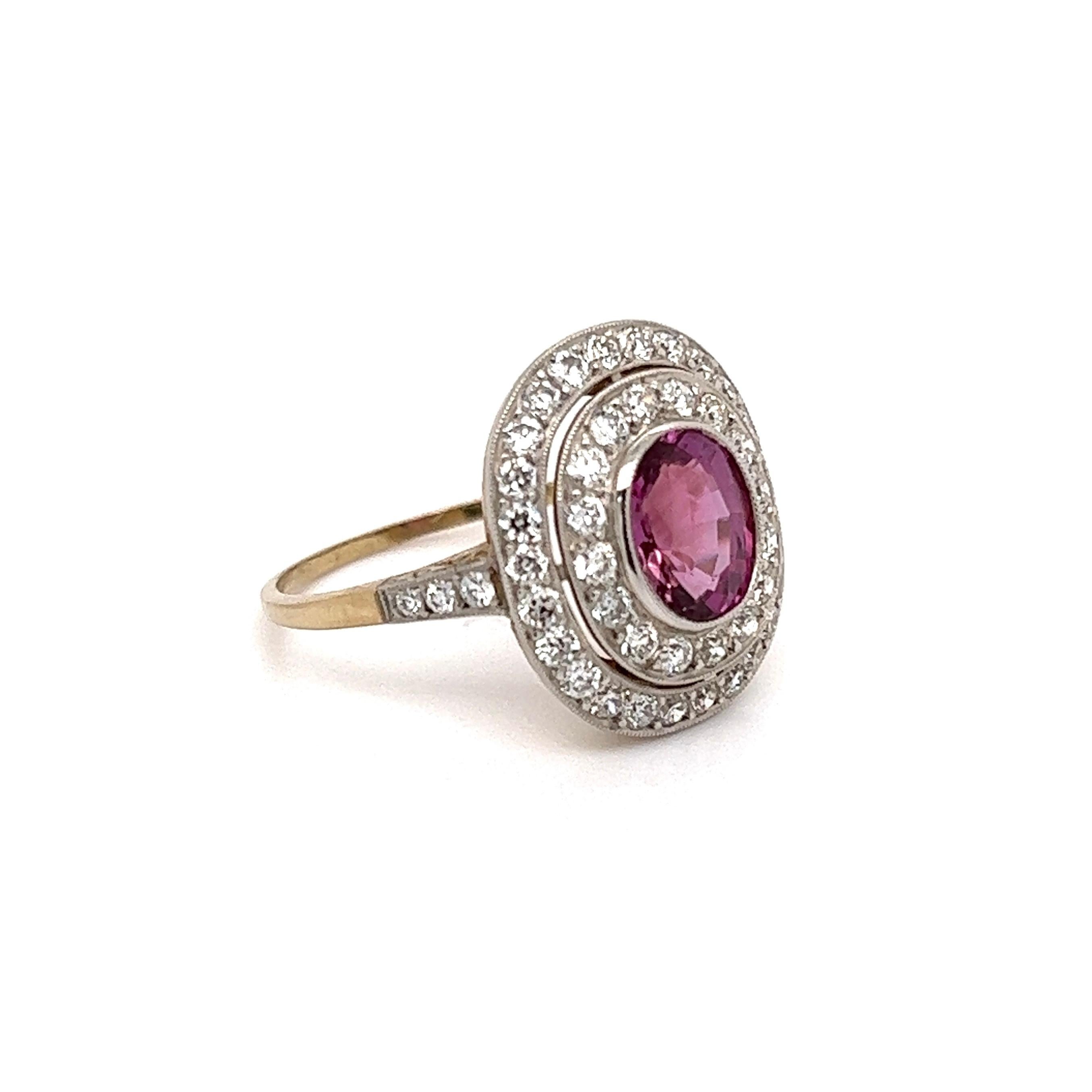 Simply Beautiful! Finely detailed Pink Sapphire and Double Diamond Platinum Art Deco Revival Cocktail Ring. Centering a securely nestled oval Pink Sapphire, weighing approx. 2.48 Carats surrounded by 1.10tcw Double Diamonds. Approx. dimensions: