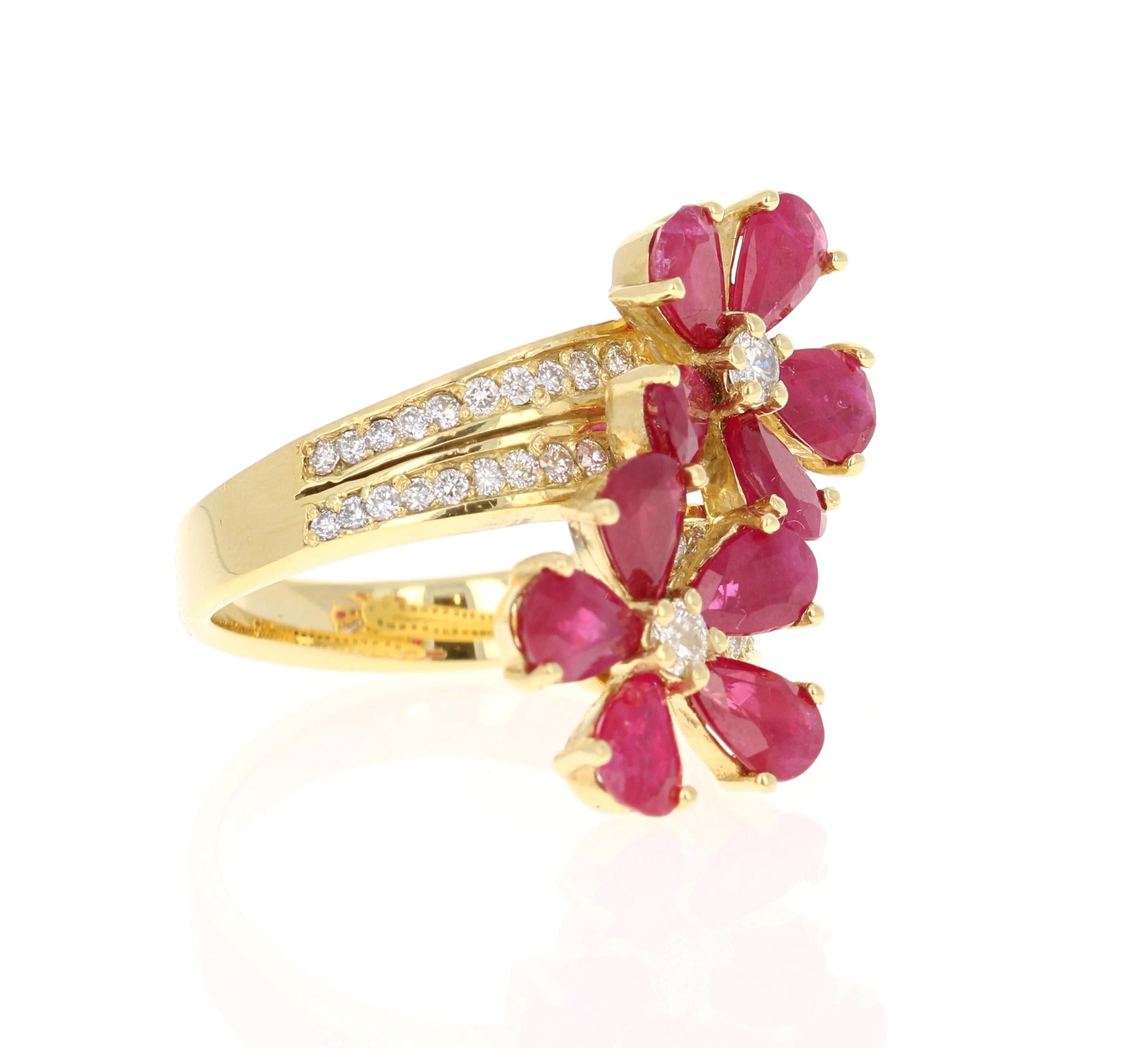 This ring has multiple Pear Cut Natural Red Rubies weighing 1.83 Carats and 46 Round Cut Diamonds  weighing 0.65 Carats. The clarity and color of the diamonds are SI1-F. 

The ring is beautifully casted in 14K Yellow Gold and weighs approximately