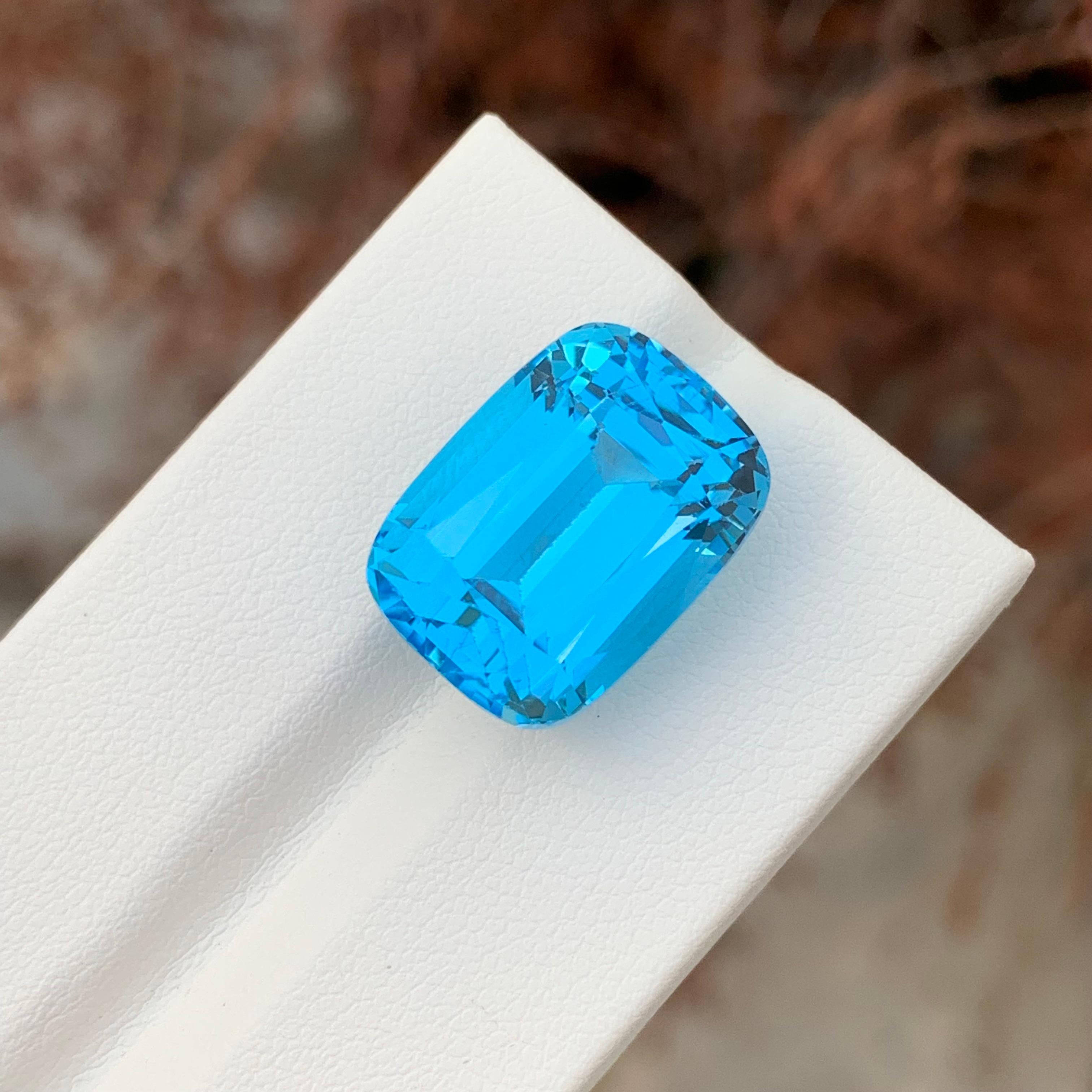 Loose Electric Blue Topaz

Weight: 24.80 Carats
Dimensions: 17.5 x 12.9 x 11.5 Mm
Origin: Brazil
Shape: Cushion 
Color:  Blue
Certificate: On Demand

Benefits Of Wearing Blue Topaz Stone:
It helps to improve communication and self-expression.
It