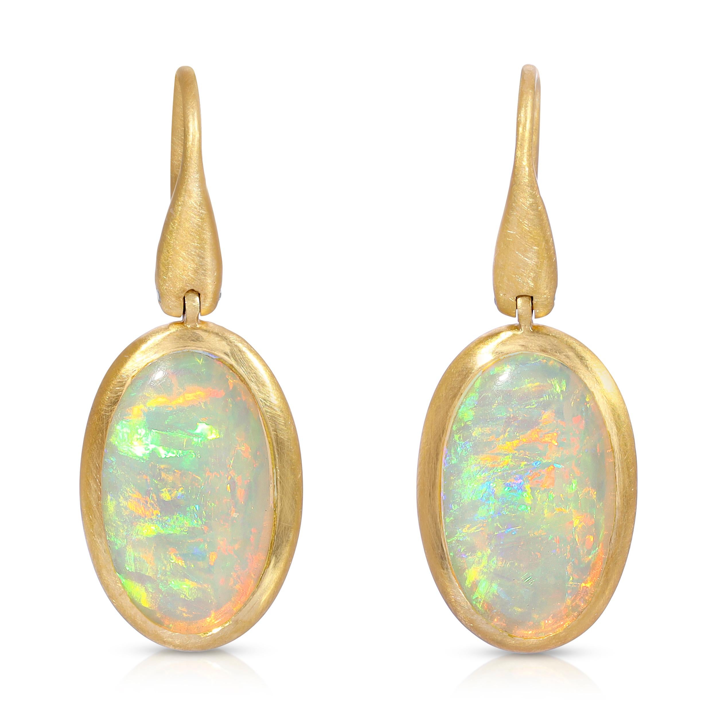 These beautiful 2.48ct Winton Australia Crystal Opal Drop Earrings are set  in 18k Matte Yellow Gold with Diamond punctuation on the side hinge. They were handmade in Los Angeles by my master craftsmen and me.
