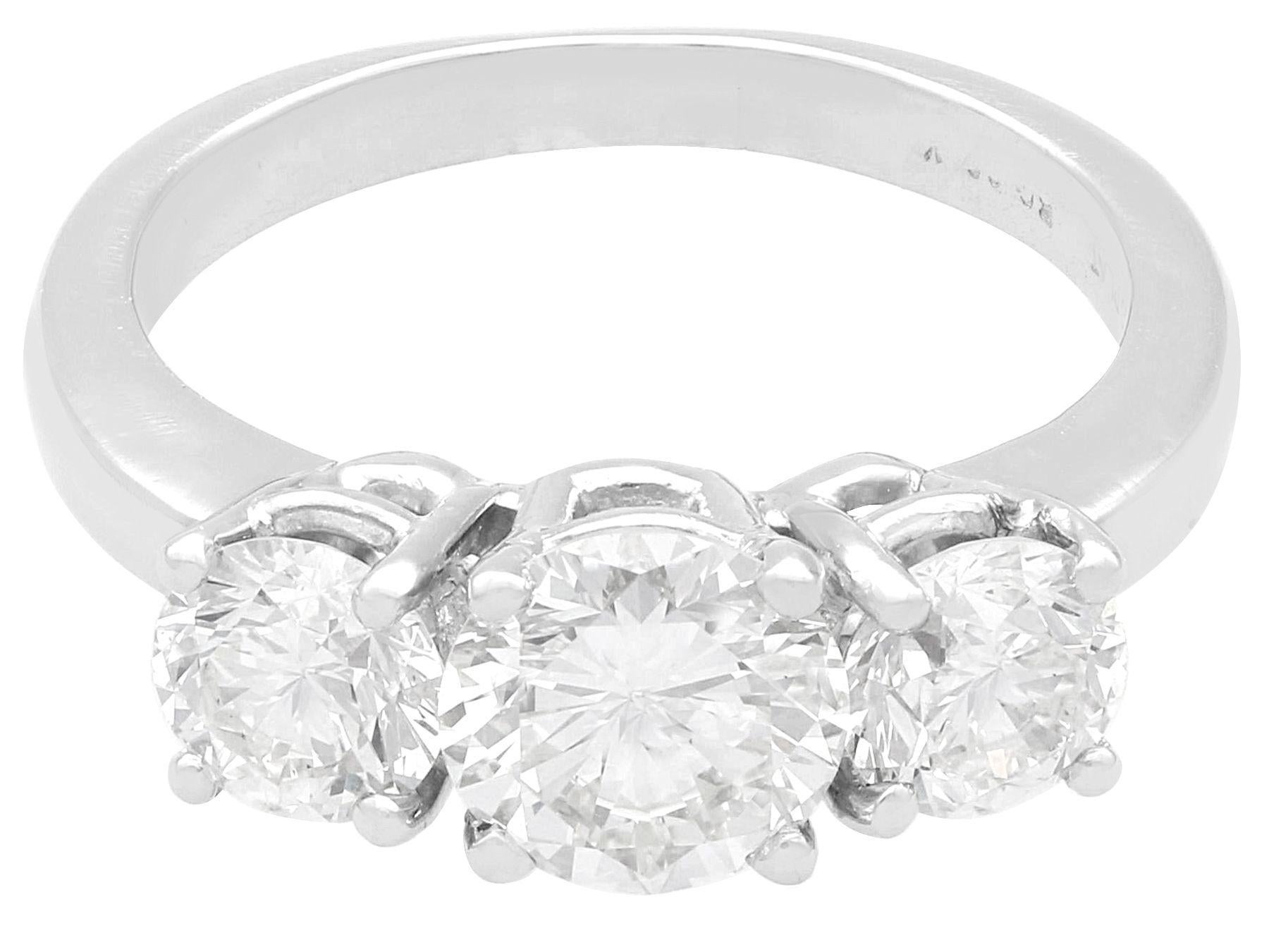Round Cut 2.49 Carat Diamond and Platinum Trilogy Engagement Ring For Sale