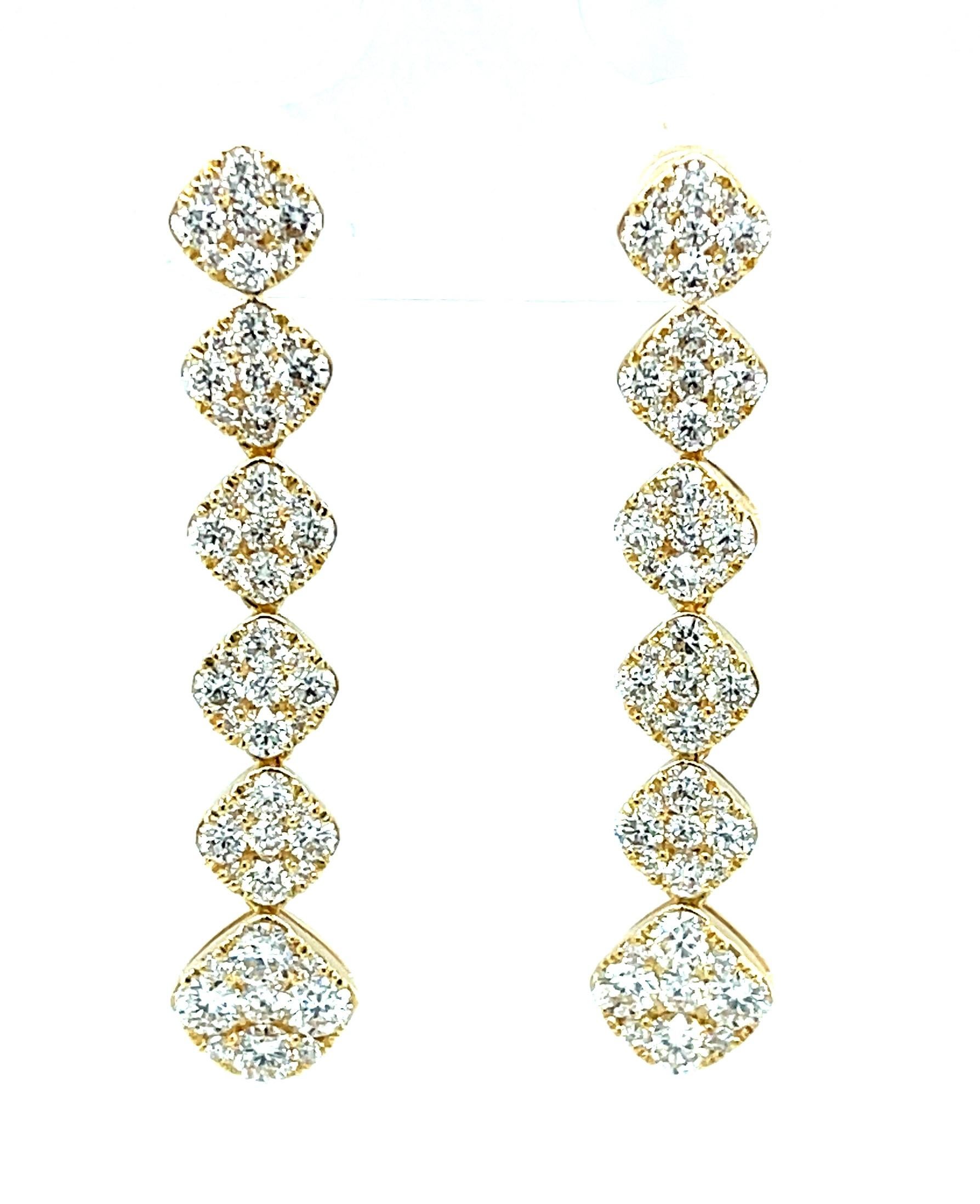 These eye-catching diamond pave and 18k yellow gold dangle earrings are the definition of sparkling elegance! They feature 2.49 carats of fine-quality round brilliant white diamonds pave set in 18k yellow gold diamond-shaped settings. The settings