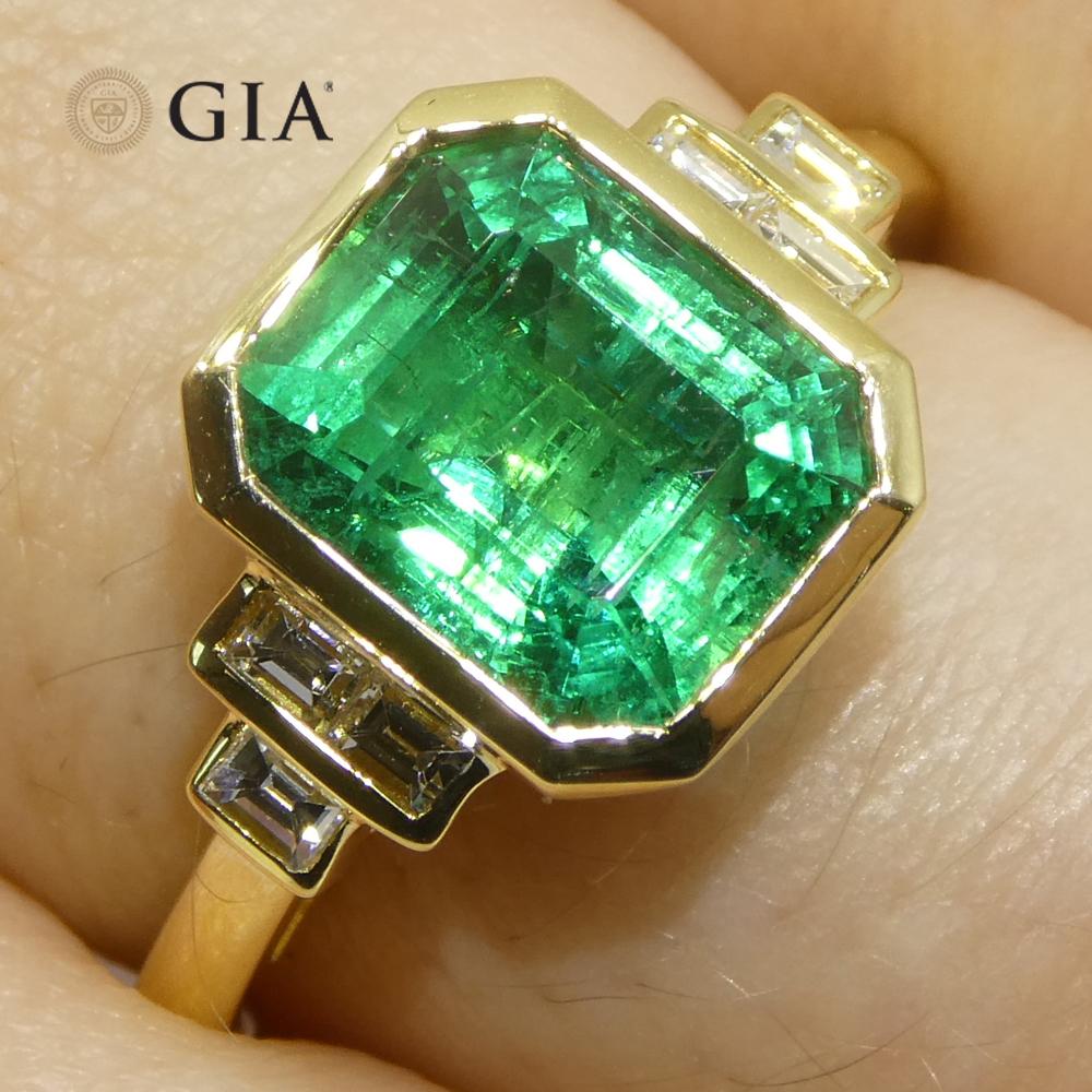 This exceptional ring features a 2.49-carat emerald-cut green emerald, sourced from Zambia and accompanied by a GIA certificate confirming its authenticity and quality.

The vivid green hue of the emerald is beautifully complemented by a halo of