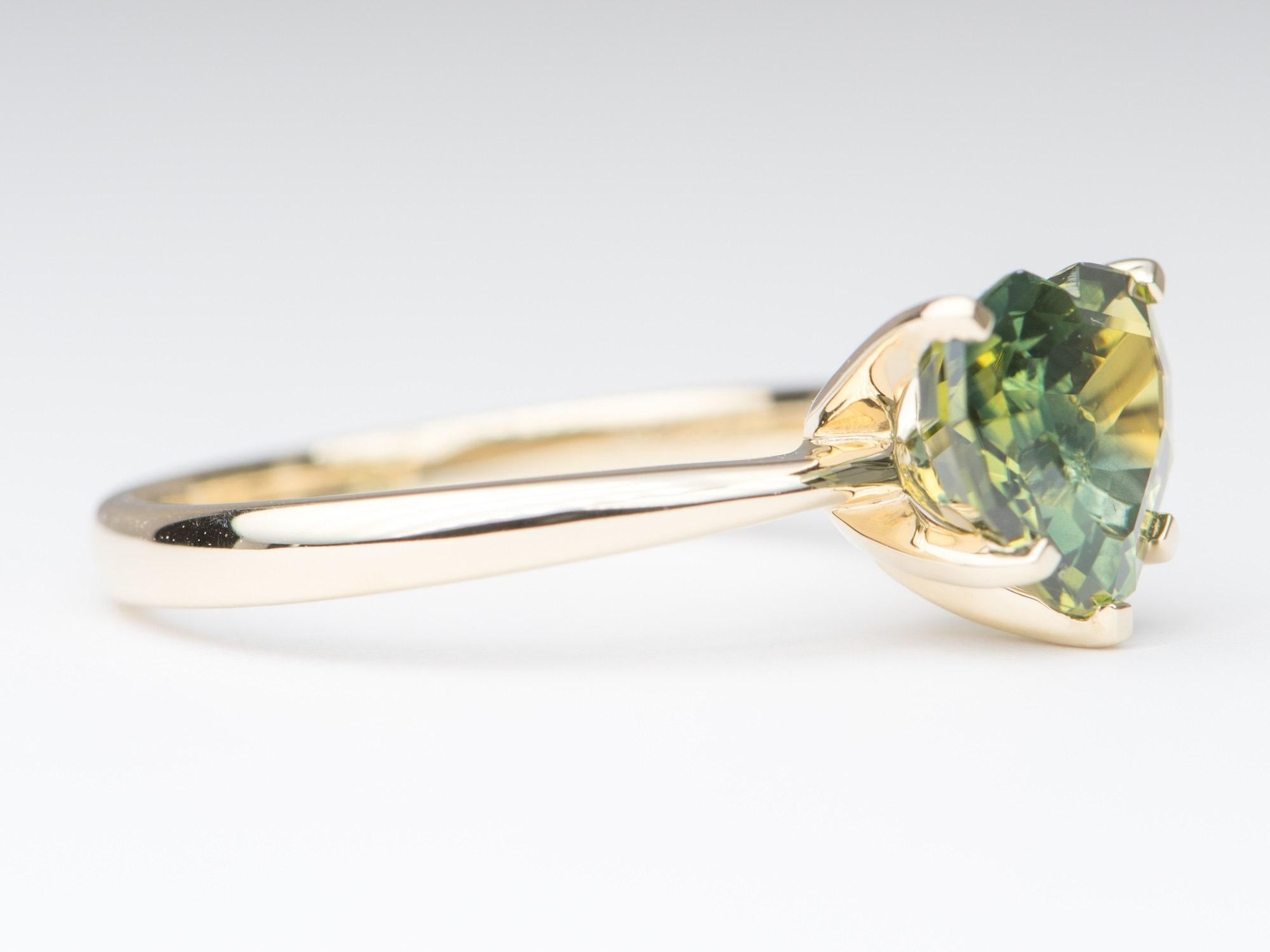 â™¥ A solid 14K yellow gold ring set with a stunning heart-shaped teal parti sapphire 
â™¥ The overall setting measures 9.1mm in width, 8.5mm in length, and sits 7.1mm tall from the finger

â™¥ Band width: 2.2mm
♥  Ring size: US 7 (Free resizing up