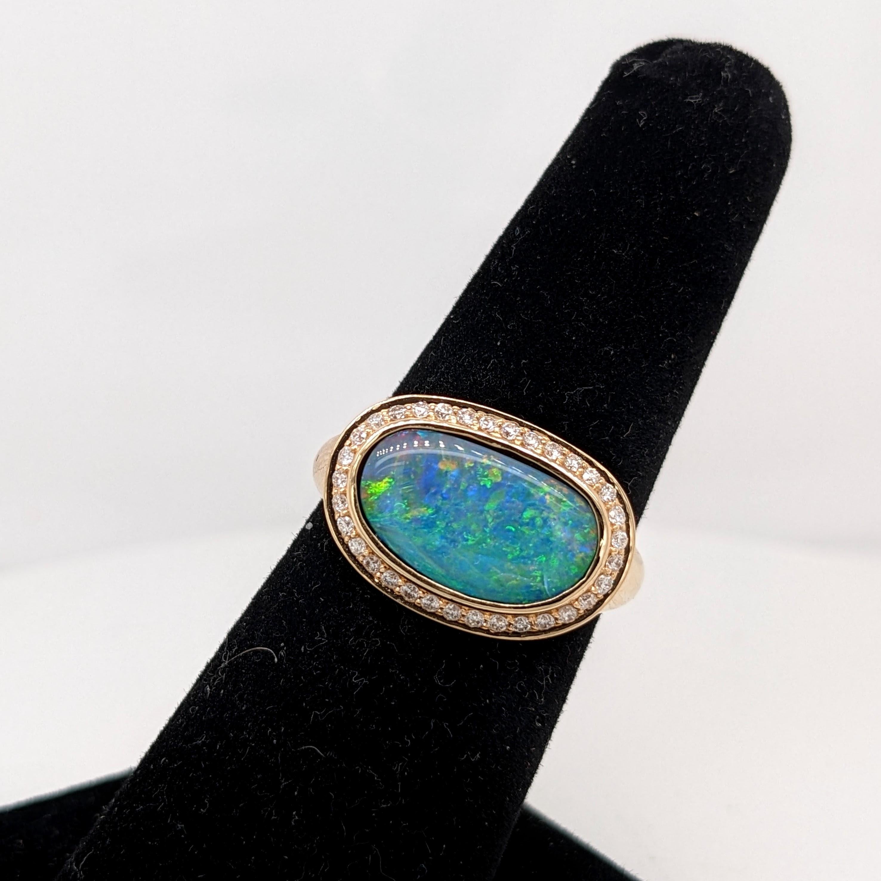 This unique ring features a black Opal with an amazing play of color. Set in solid 14k Gold, this piece is accented with natural diamonds.

The occasions to show off this ring are endless - mother's day, graduation, wedding, birthday, date night,