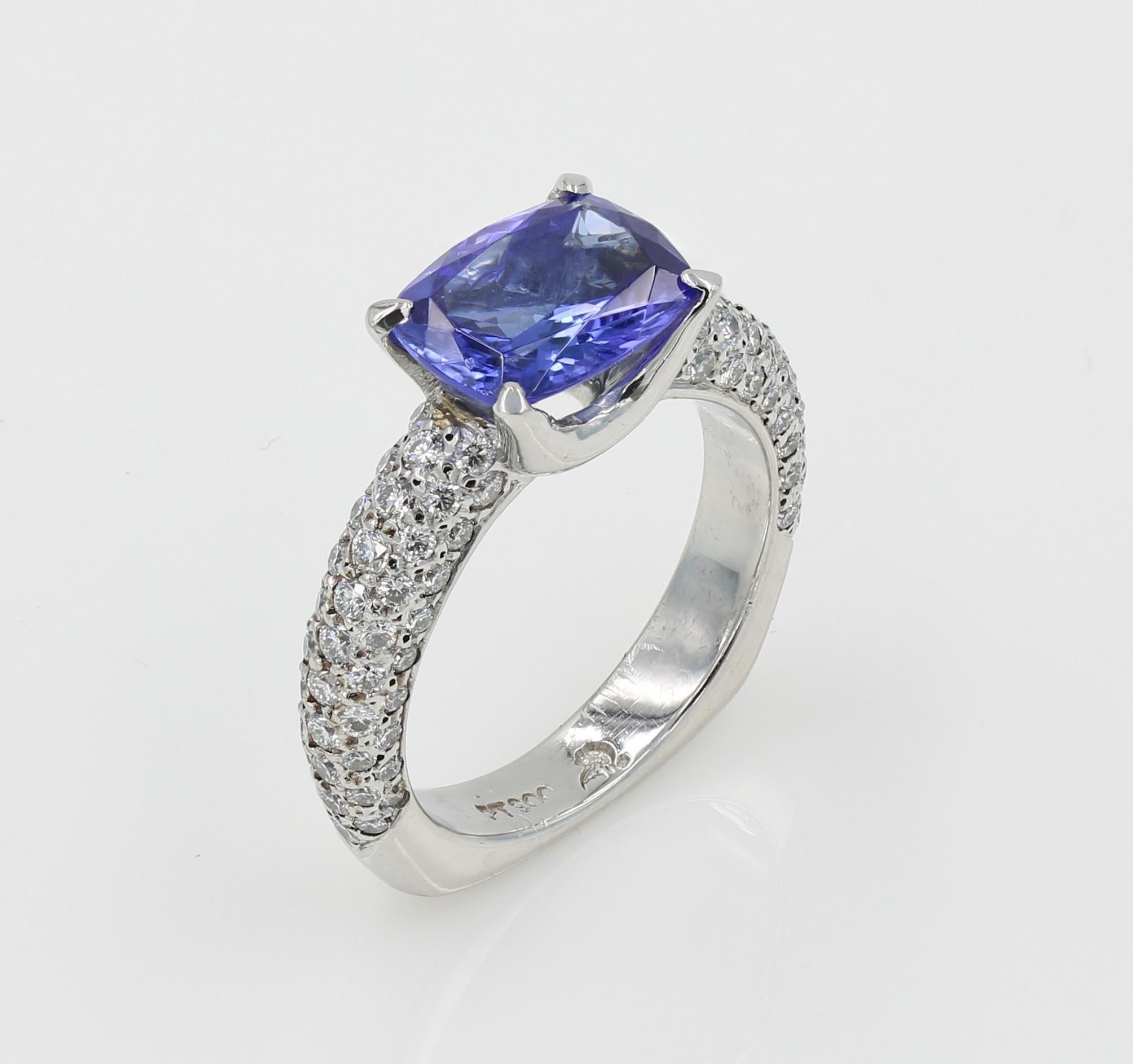 2.49cts. Cushion cut Tanzanite and Natural Diamond ring in Platinum.

96 Natural Ideal Cut Diamonds (G-H VS) weighing 0.95ct total. Pave set in Platinum with the Tanzanite set in the center. 
Ring is a Lester Lampert original creation in a size 6.