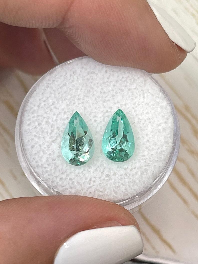 Stone: Emerald
Total Weight: 2.49-tcw
Shape: Pear Cut
Clarity: Transparent
Luster: Excellent
Color: Light Green
Measurements: 9.96mm x 5.83mm x 4.43mm // 9.69mm x 5.85mm x 4.47mm
Geographic Origin: Colombia
Treatment: Natural, Oiling

No two