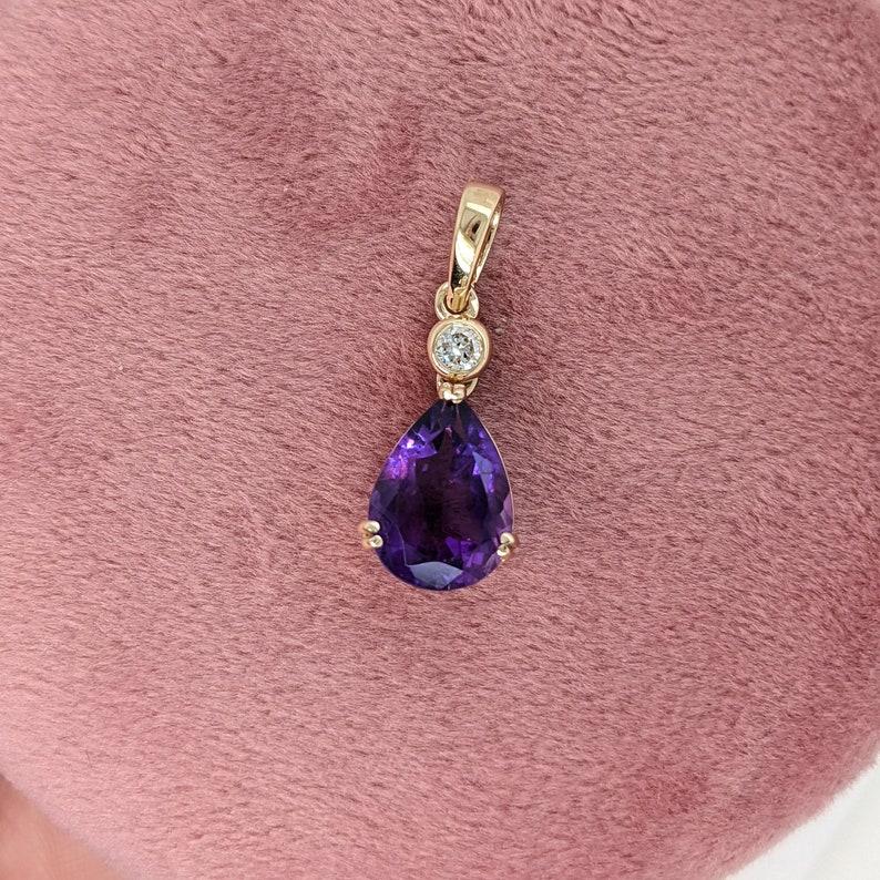 A rich purple amethyst pendant in a pear cut shape with a little natural diamond accent for a lovely added shine! If you love this setting, we can make it work for any center stone!

Specifications:
Item Type: Pendant
Center Stone: