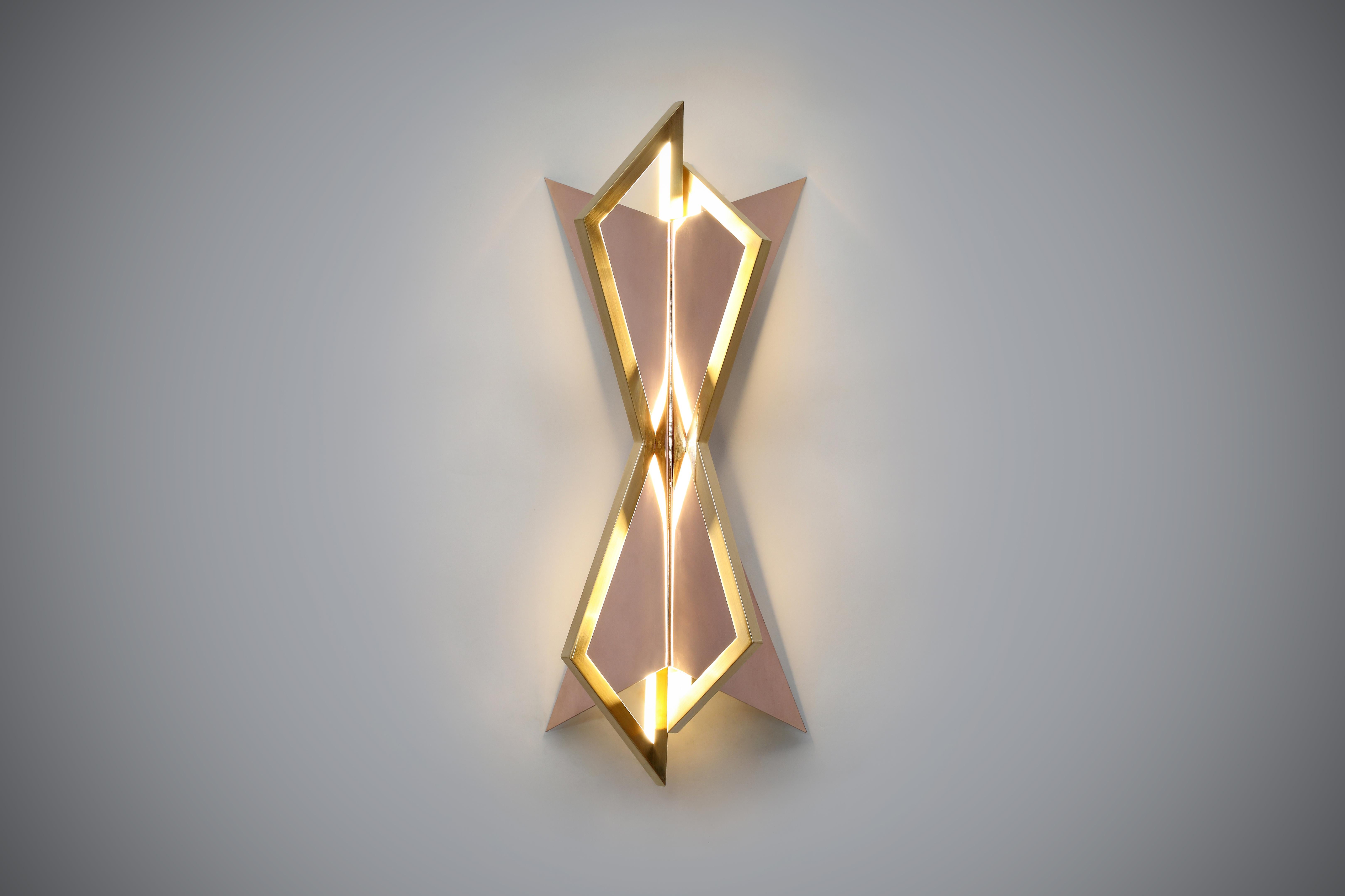 Handcrafted and finished in 24ct gold and rose gold, this exceptional wall light is the epitome of luxury. With its clean-cut lines and polished finish, this is one of our favourite works of art. There is the option to choose from our standard