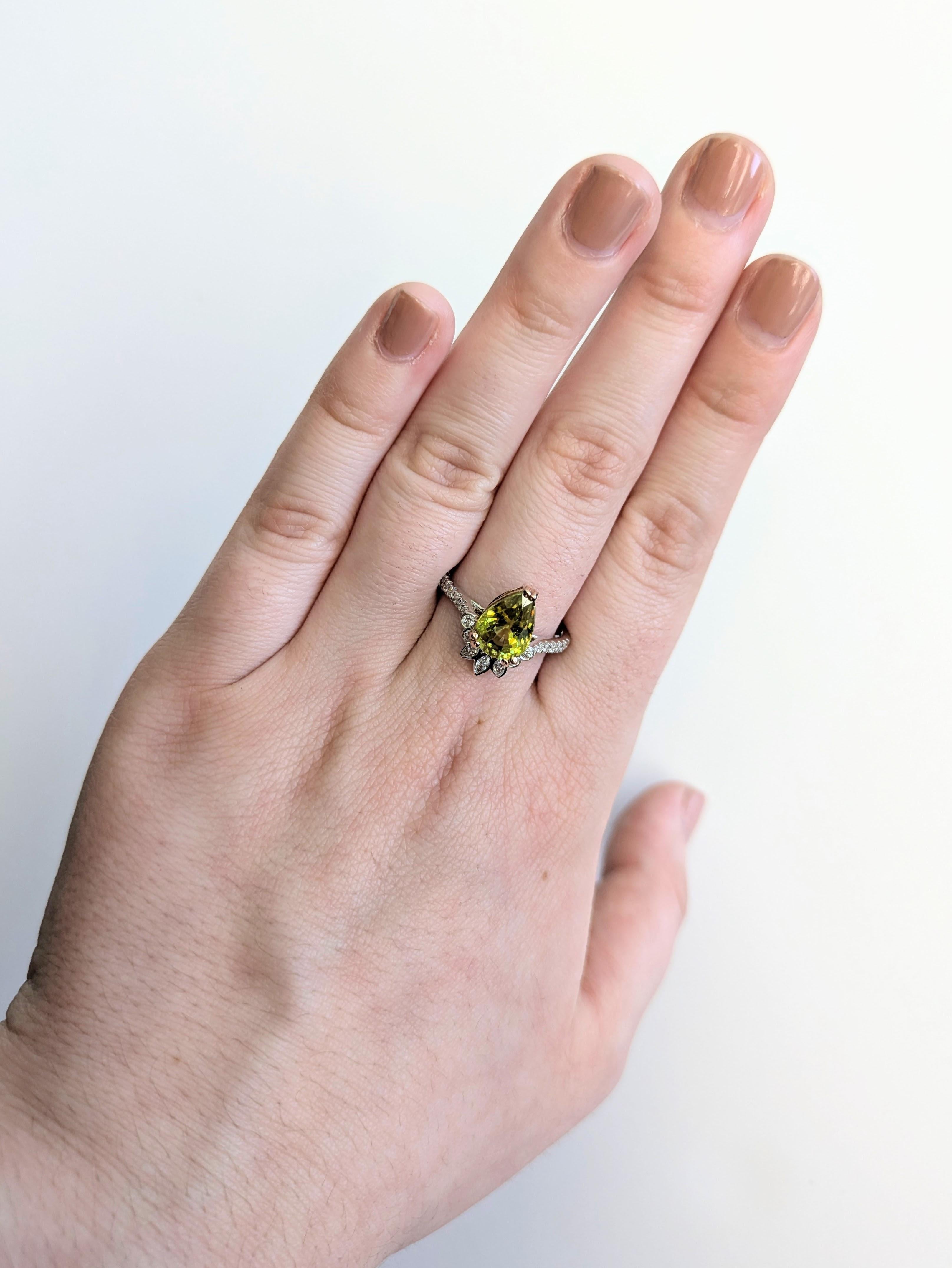 A luminous 2.4 carat sphene is the star of this statement ring, enhanced by glittering natural diamonds. Set in genuine 14K solid gold, this ring is a standout piece for lovers of unique fine jewelry.

**We offer complimentary resizing, message us
