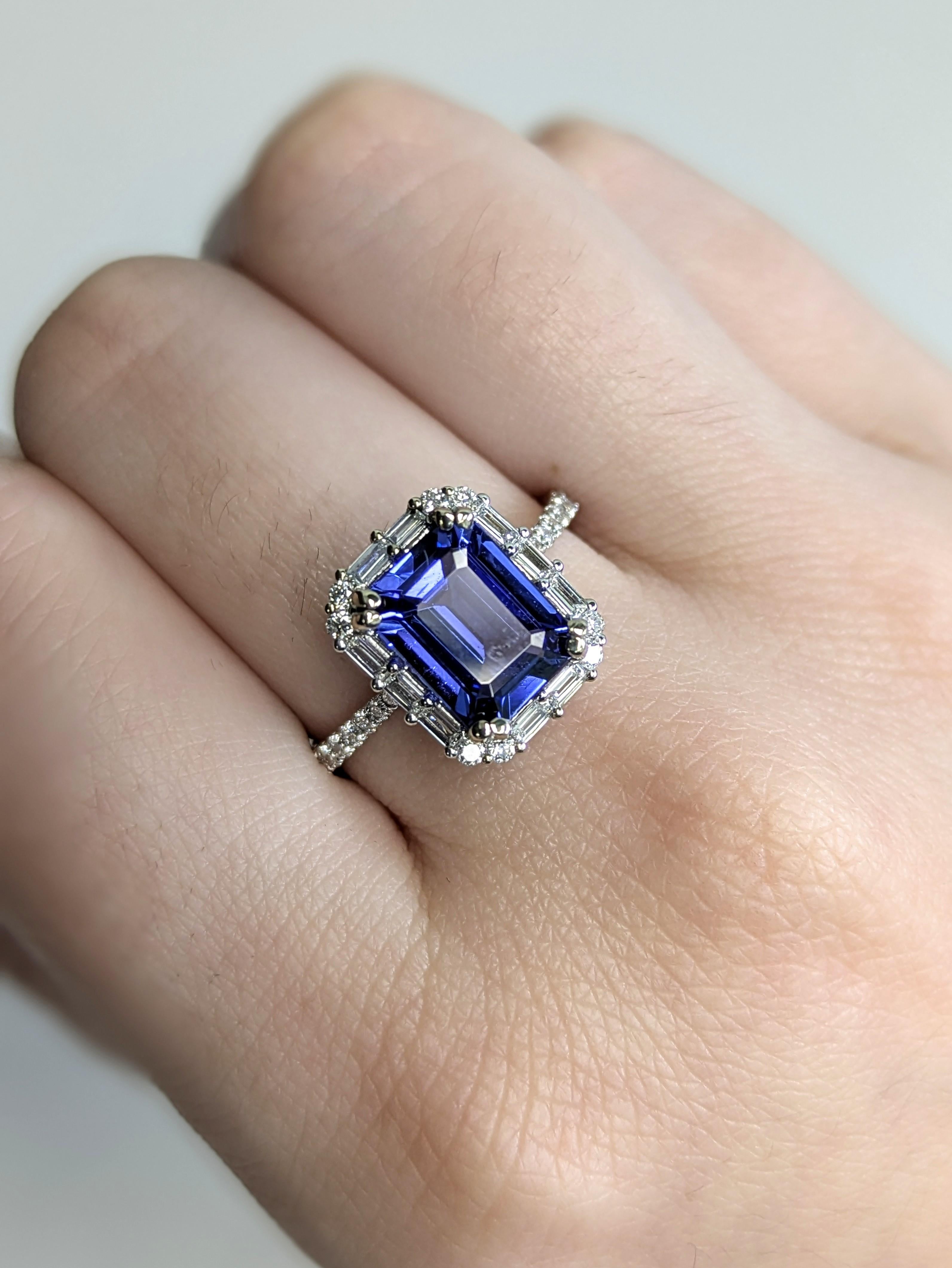 Say yes to a love as rare as Tanzanite. This 2.42ct gem is encircled by a halo of natural diamonds and a pave diamond band, all crafted in solid 14k white gold—a radiant and unforgettable twist on the classic engagement ring.

**We offer