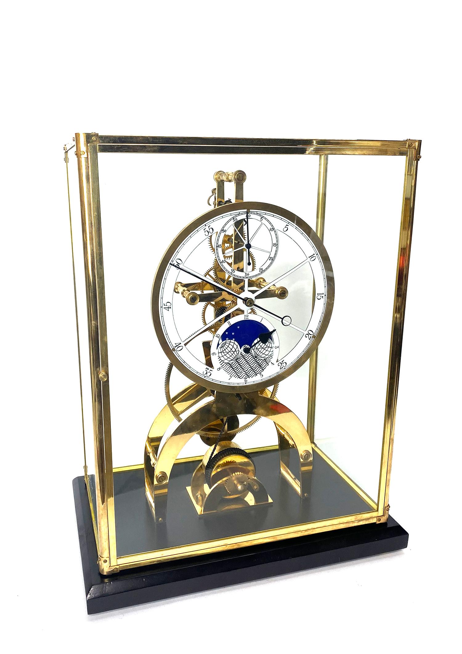 24k Astronomical Porcelain dial 8 day Fusee chain Skeleton clock with moon dial

Here is a very nice looking 24K plated large skeleton clock, housed inside a brass frame glass case. It has a front opening door, so you can easily set and wind the