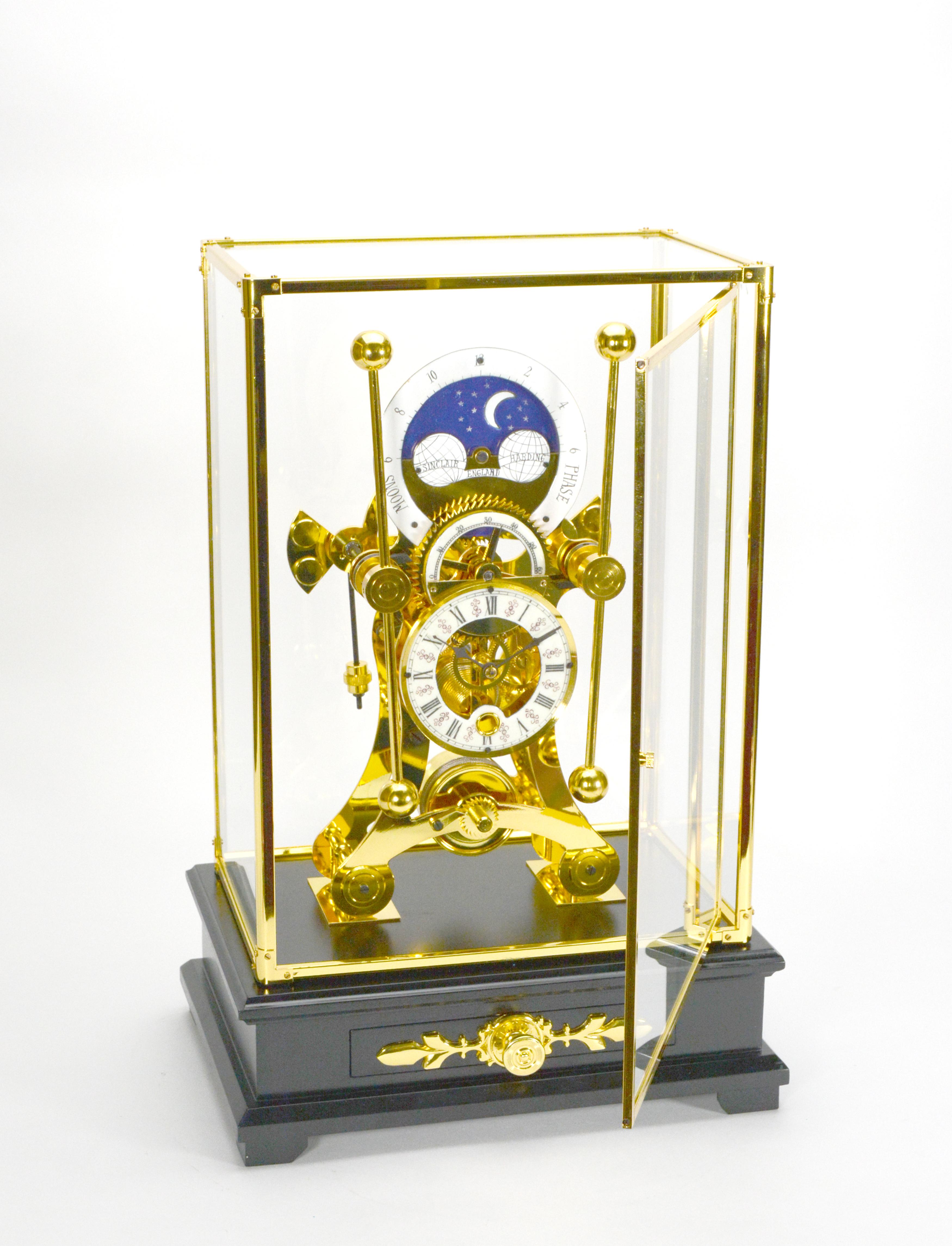 24K English Style Grasshopper Fusee Double Pendulum Moon Dial Skeleton Sea Clock

Here we are offering a fantastic grasshopper sea clock. It has an unique fusee movement. The clock is sitting on a wood base with a protective glass dome. The dome has